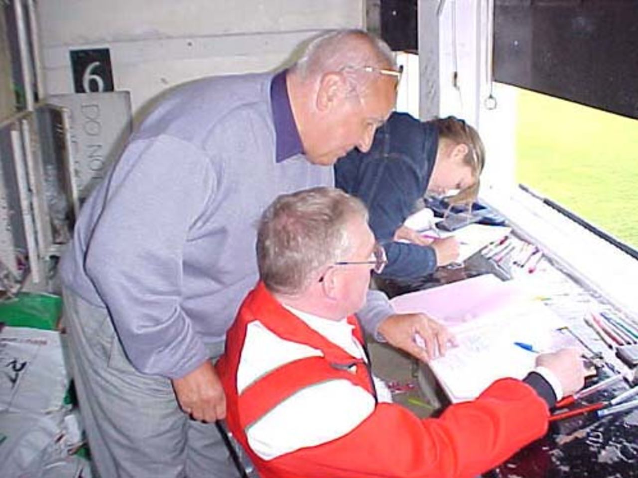 Ronnie Walton checkes the details for the 'Man of the Match' award