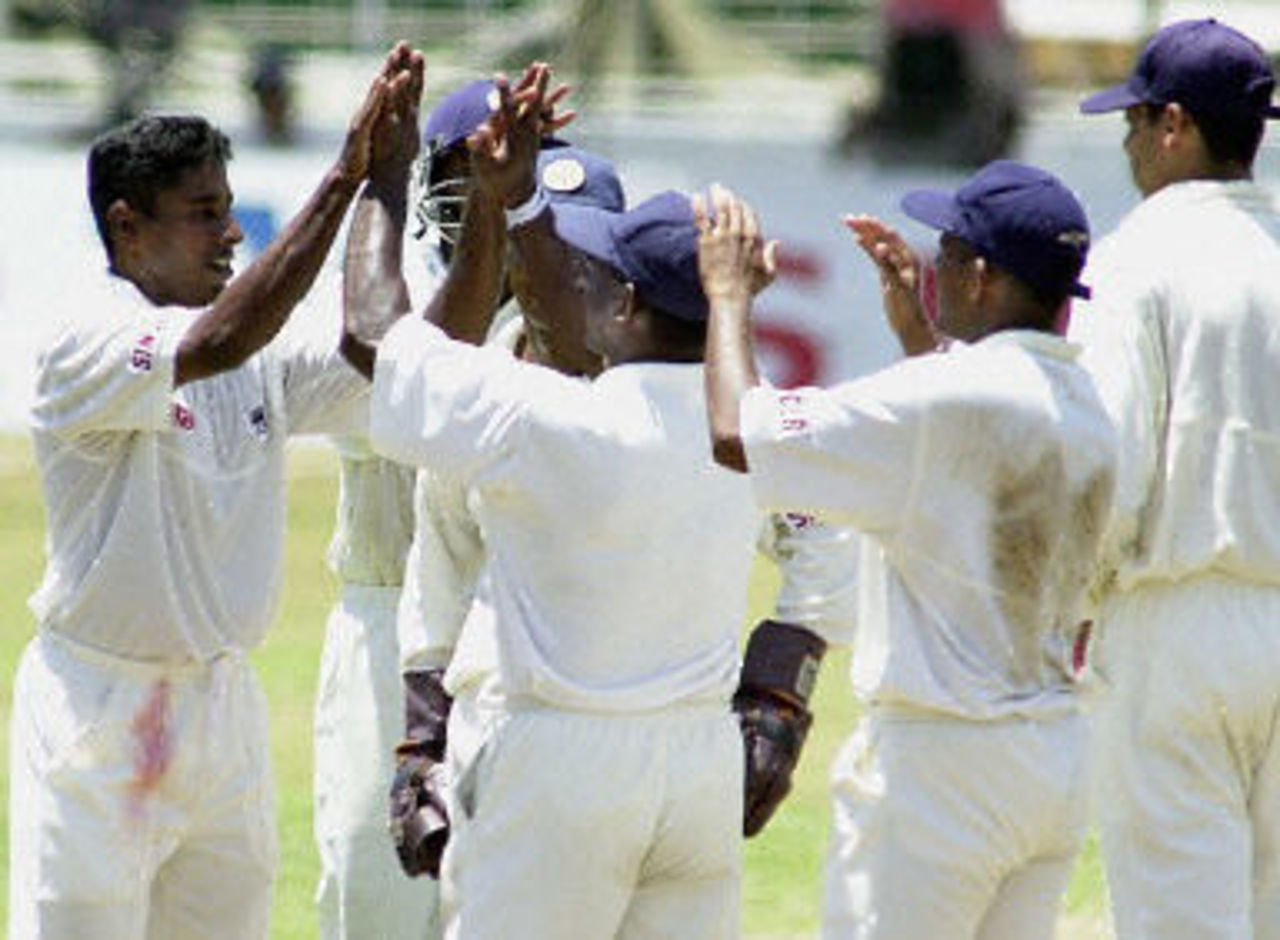 Chaminda Vaas gets the 'high fives' from Sri Lankan team after taking a Bangladeshi wicket. Asian Test Championship 2001-02, 2nd Match, Sri Lanka v Bangladesh, Sinhalese Sports Club Ground.