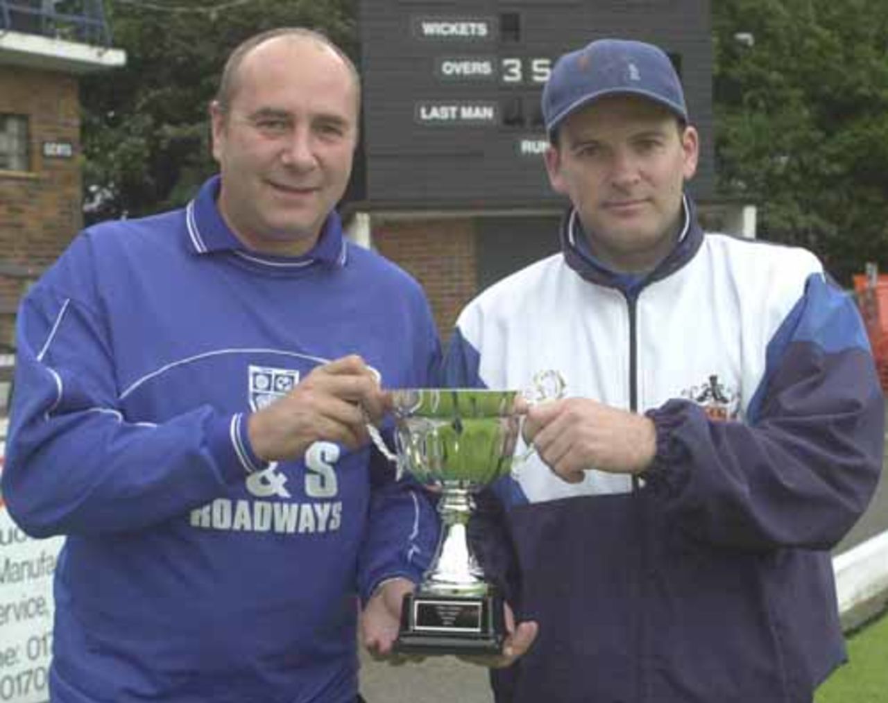 The two finalists captains Mark Price (left), Ramsbottom and Andy Payne,(right) of Rawtenstall pictured with the winners trophy before the match