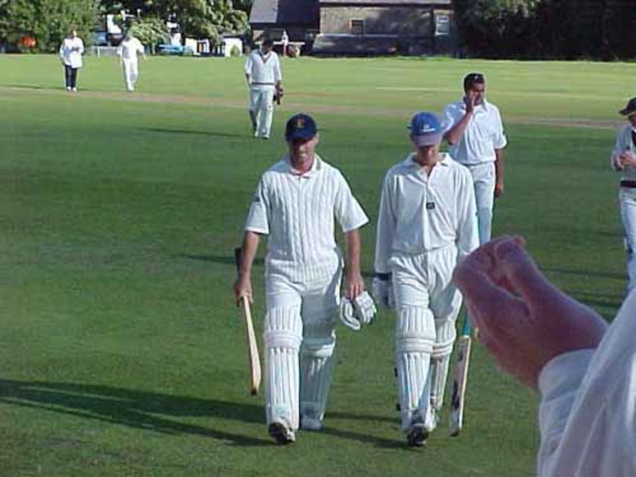 And it's goodbye to Harwood's Dan Cheesbrough (left) after hitting the winning runs