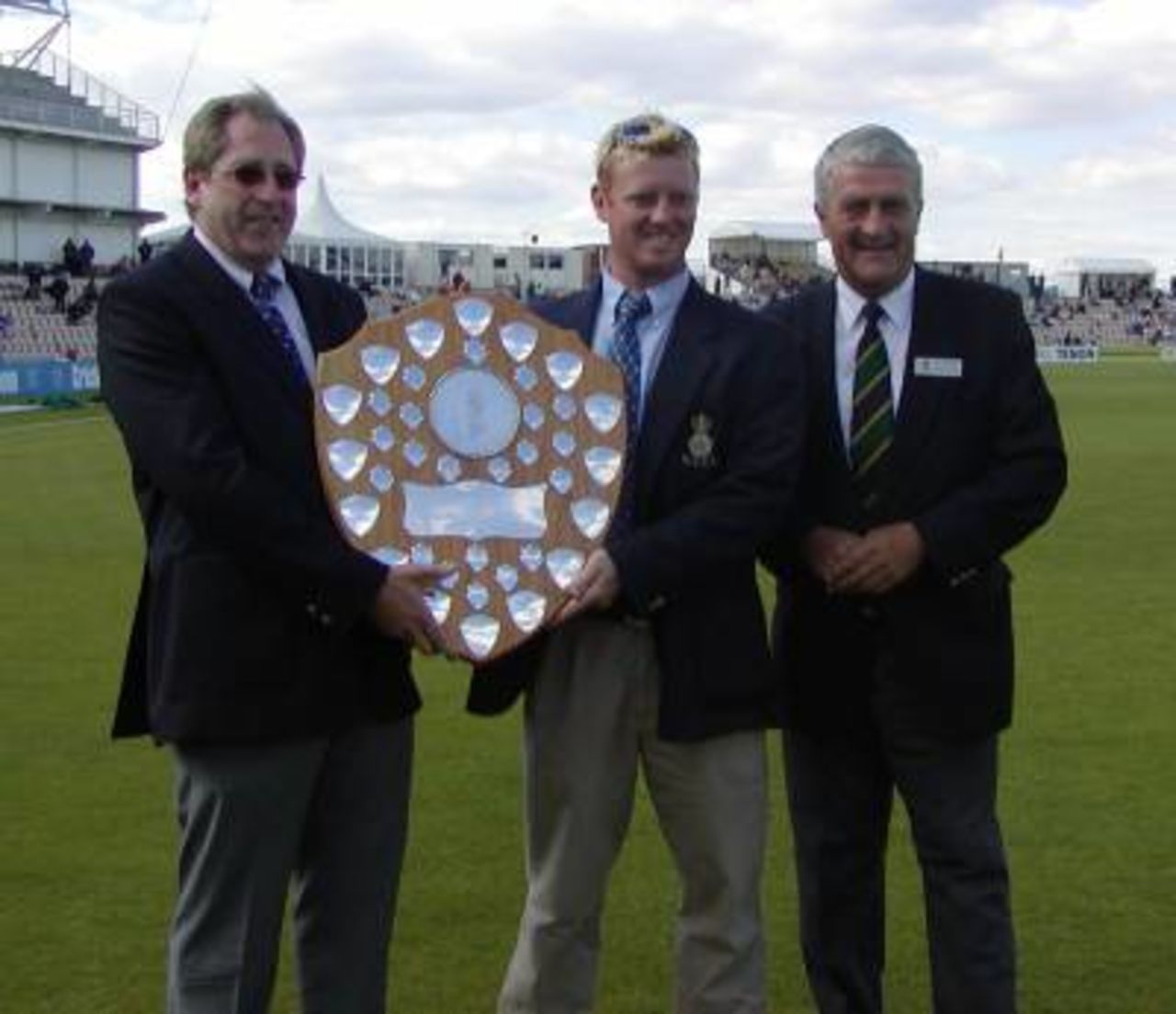 Hampshire 2nd XI captain Jason Laney receives the Shield from Hampshire chairman Rod Bransgrove at The Rose Bowl.