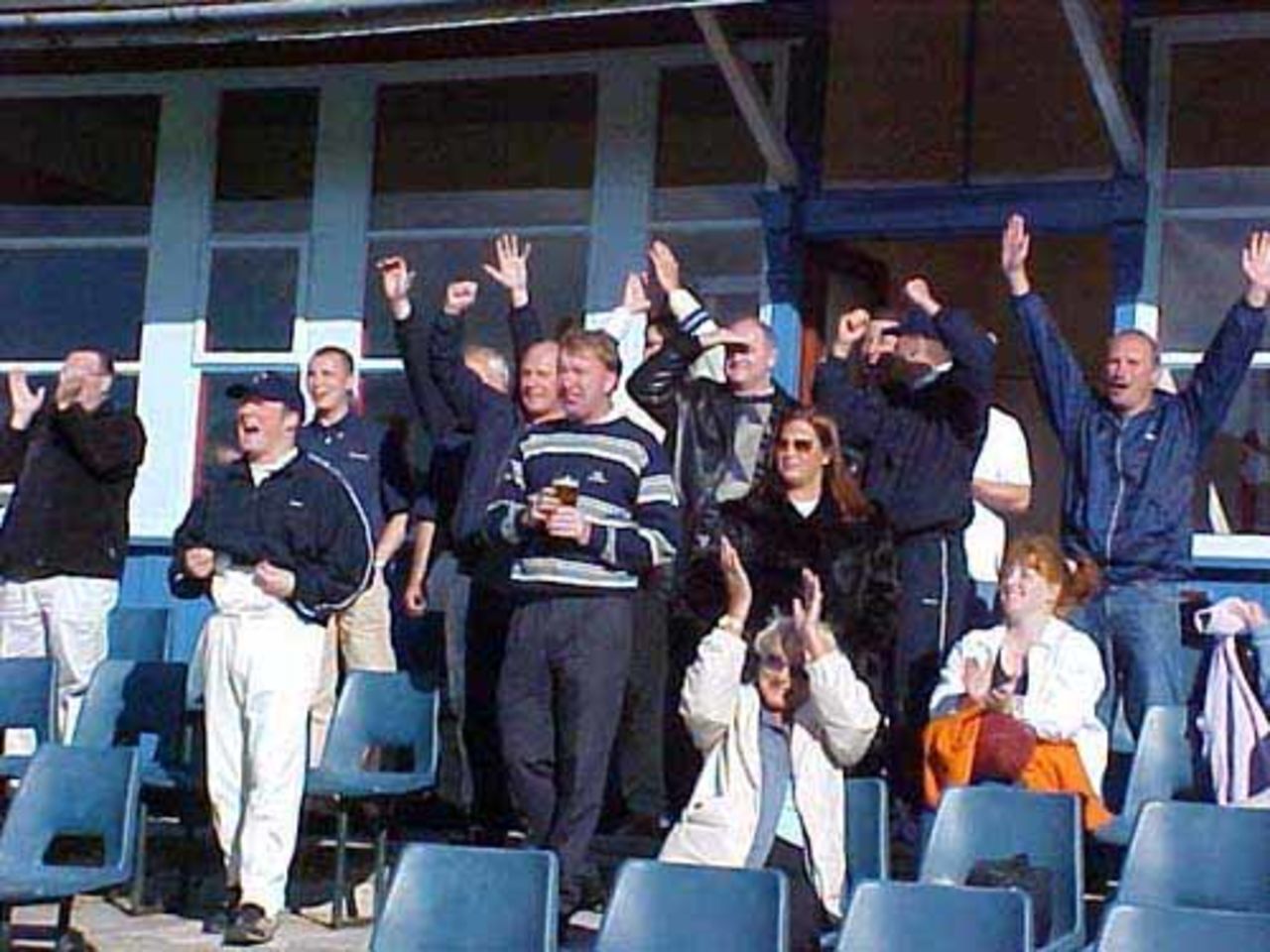 The Bacup supporters cheer the winning hit