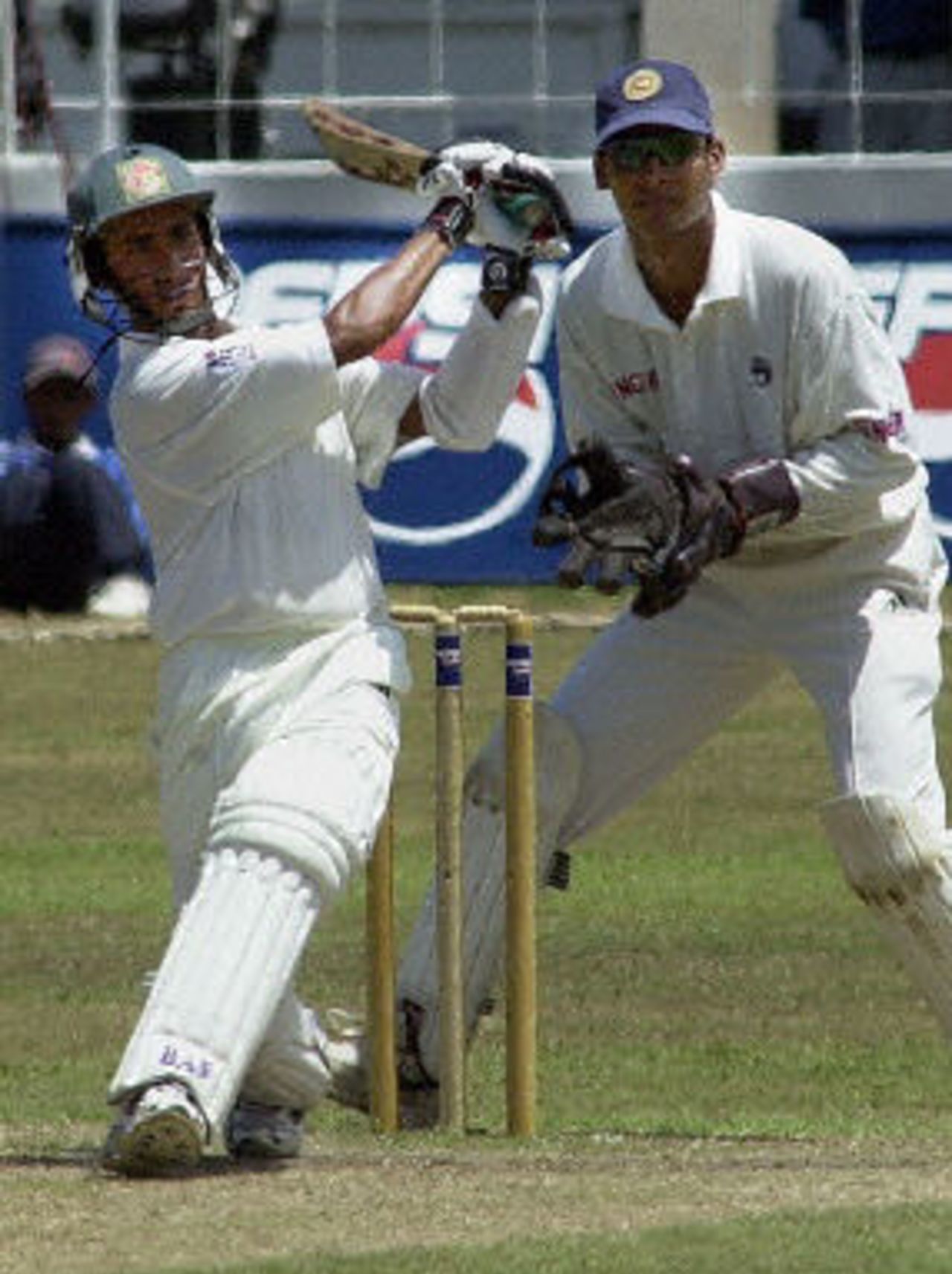 Mohammad Ashraful hits a ball to the boundary as wicketkeeper Sangakkara looks on, Asian Test Championship 2001-02, 2nd Match, Sri Lanka v Bangladesh, Sinhalese Sports Club Ground, Colombo.