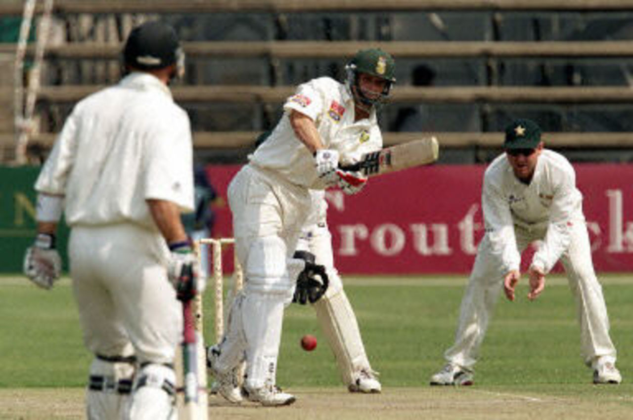 Gary Kirsten drives watched by Alistair Campbell, Ist Test South Africa v Zimbabwe, 7-11 September 2001, at Harare.