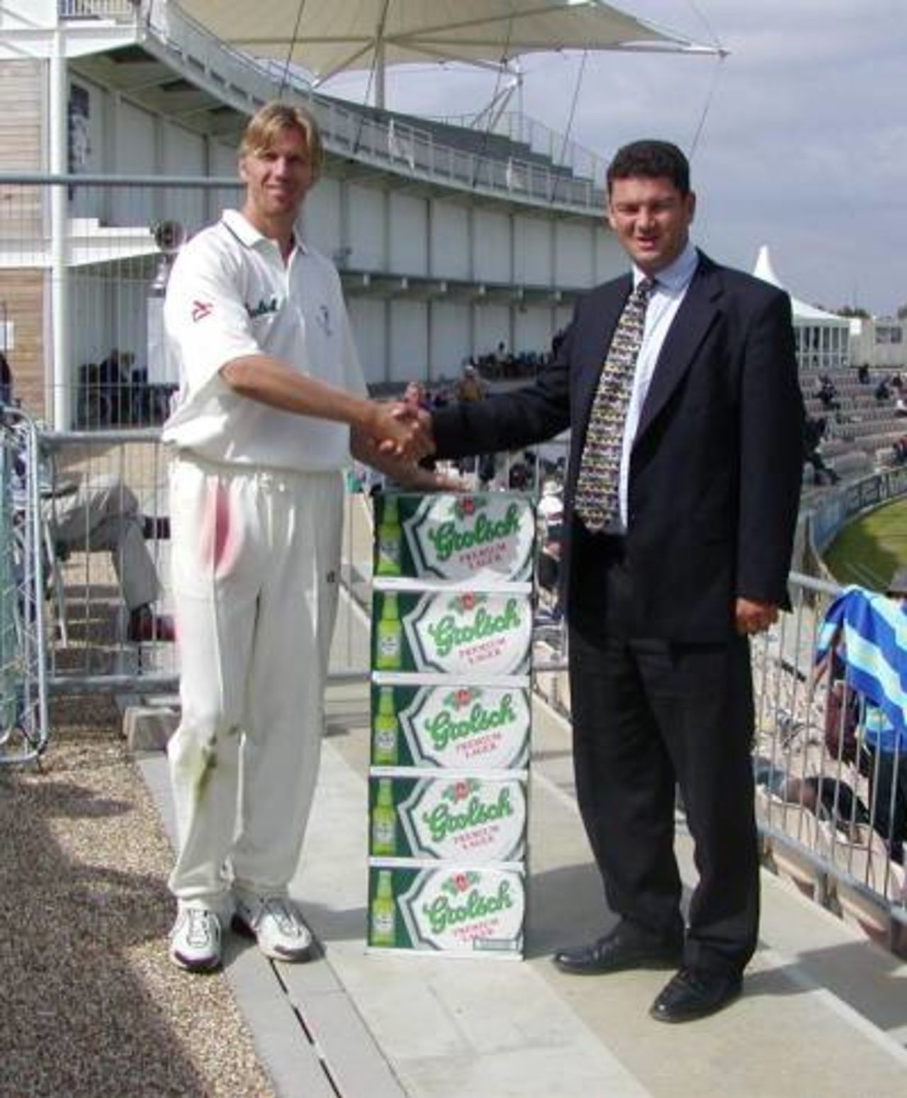 Alan Mullally receives 96 cans of Grolsch lager for his player of the month award for July 2001