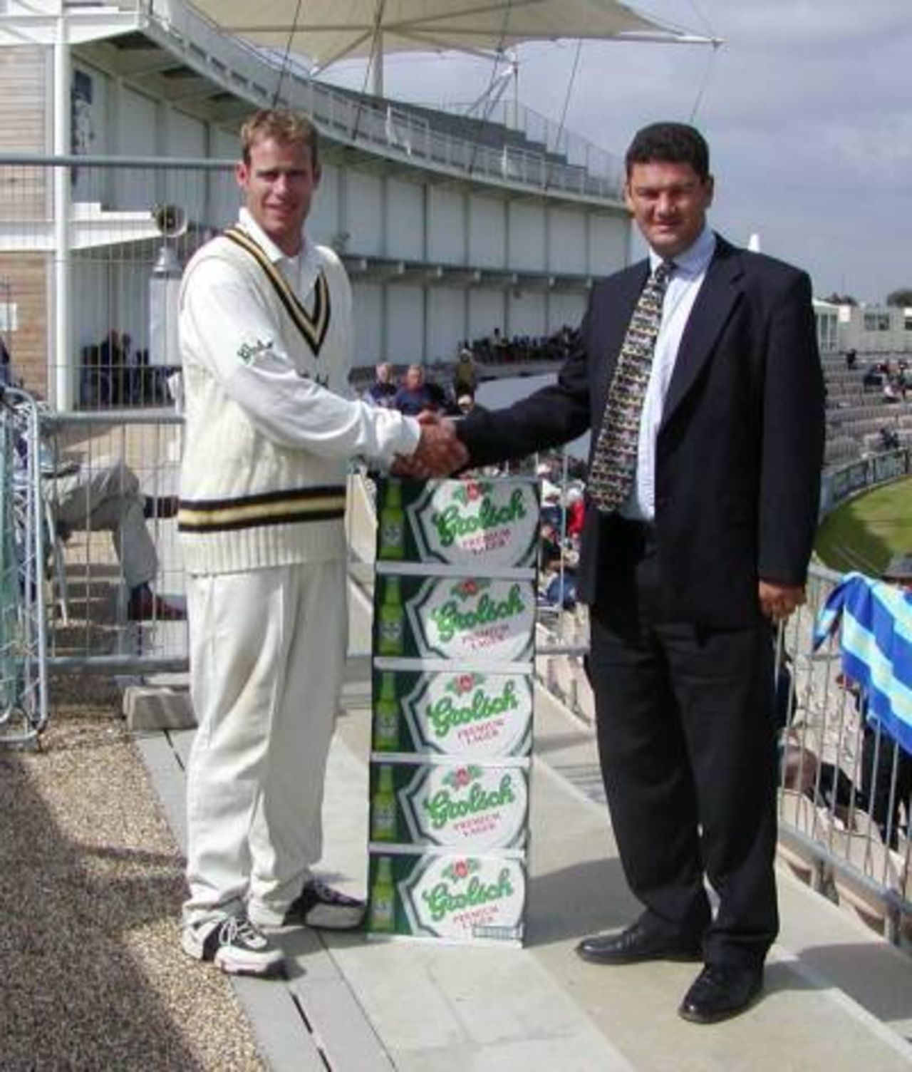 Neil Johnson receives 96 cans of Grolsch lager for his player of the month award for July 2001