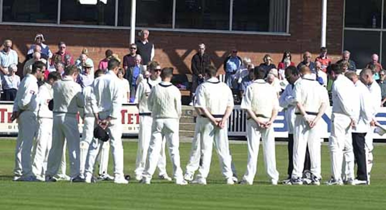 The players stand in front of the Scarborough Pavilion in respect of the dead from the New York terrorist attack, Scarborough 14th Sep 2001