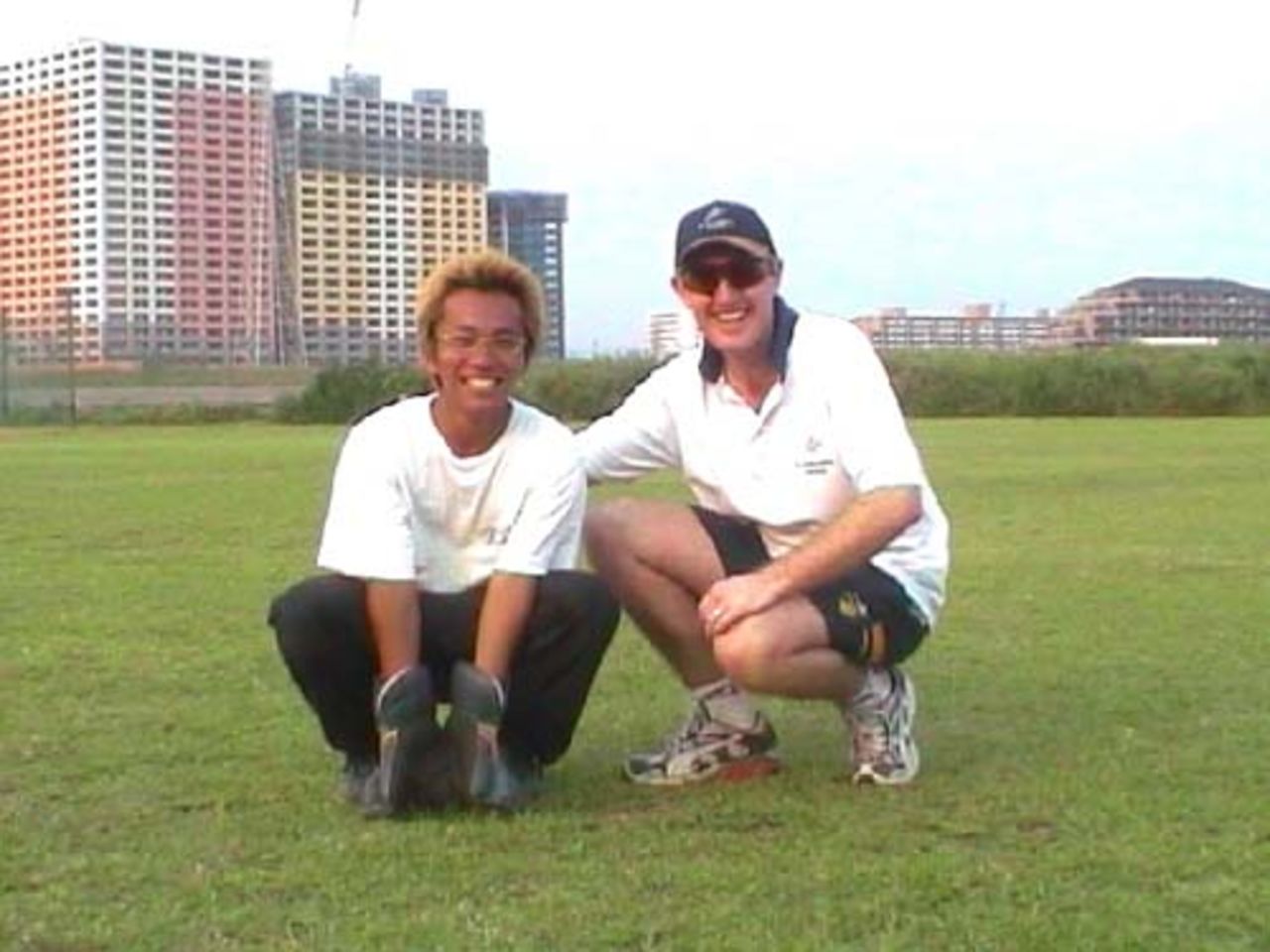 Mark McAllion giving some tips to young Japanese wicketkeeper, Yuta Yamaguchi`