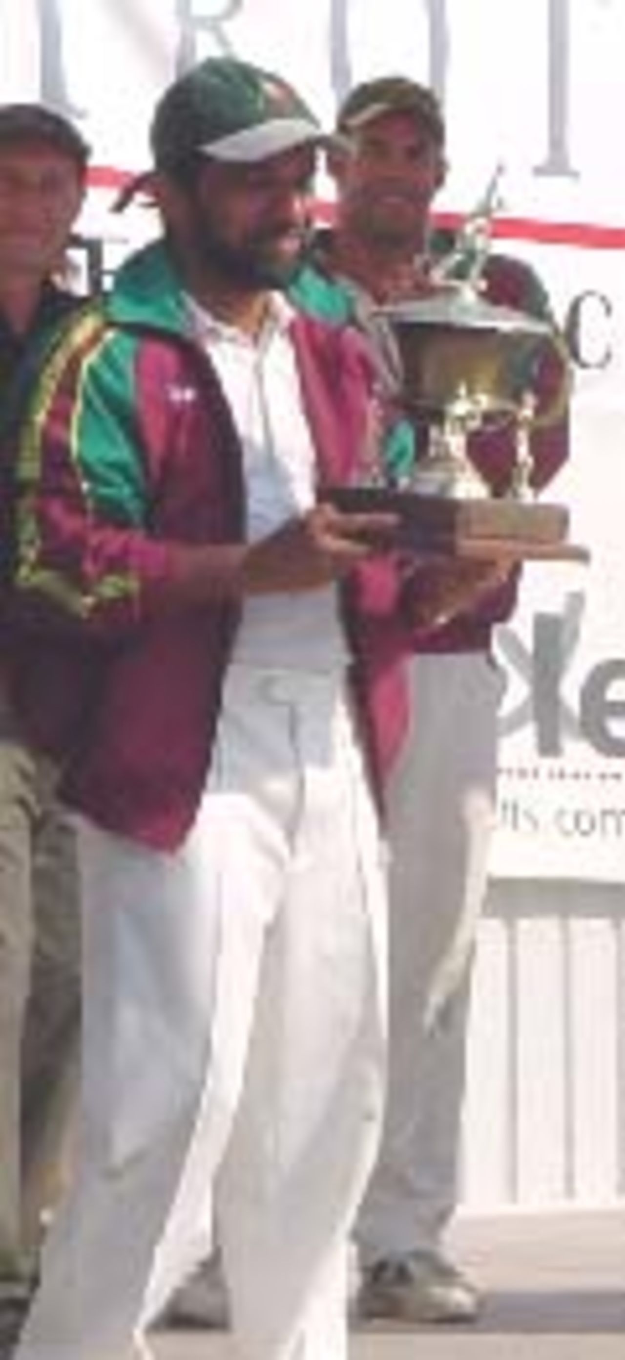 Portuguese captain Akbar Saiyad holds the ECC Trophy