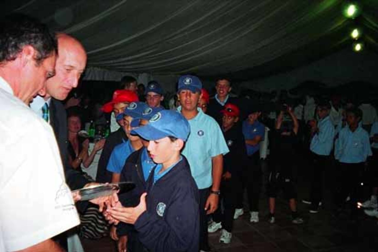 Ian Stuart presents Israel captain Reuven Bergman with the winners trophy