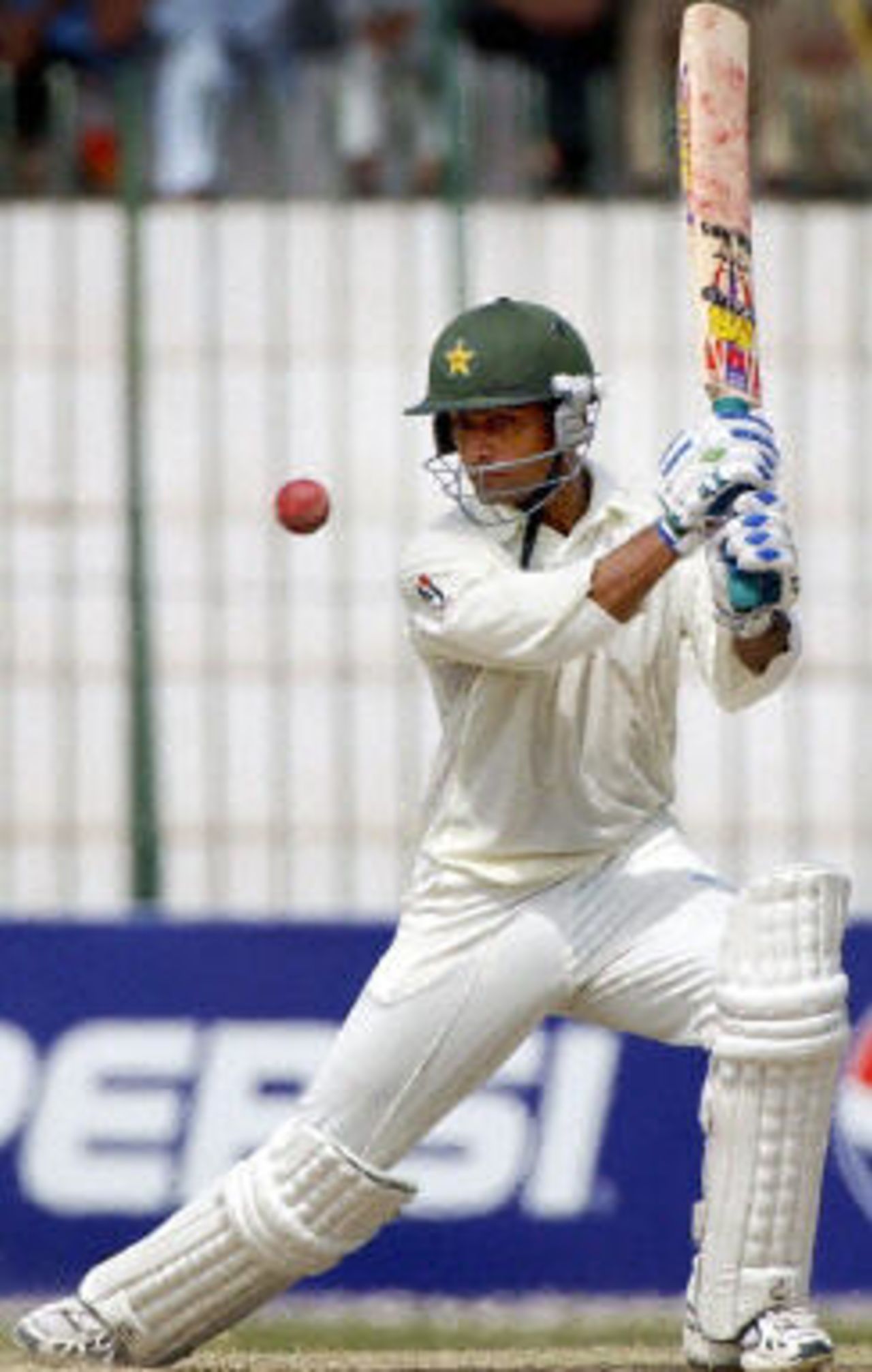 Mohammad Hafeez hits a boundary while scoring his first Test century during the fourth day of the second Test between Pakistan and Bangladesh in Peshawar, 30 August 2003.