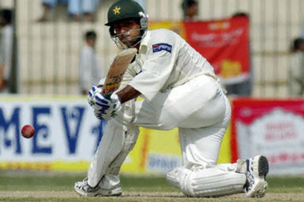 Mohammad Hafeez sweeps for another boundary on his way to a first century during the fourth day of the second Test between Pakistan and Bangladesh in Peshawar, 30 August 2003.