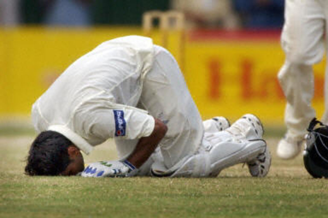 Mohammad Hafeez goes down in a 'Sajda' in thanks to God after scoring a century during a the fourth day of the second Test between Pakistan and Bangladesh in Peshawar, 30 August 2003.