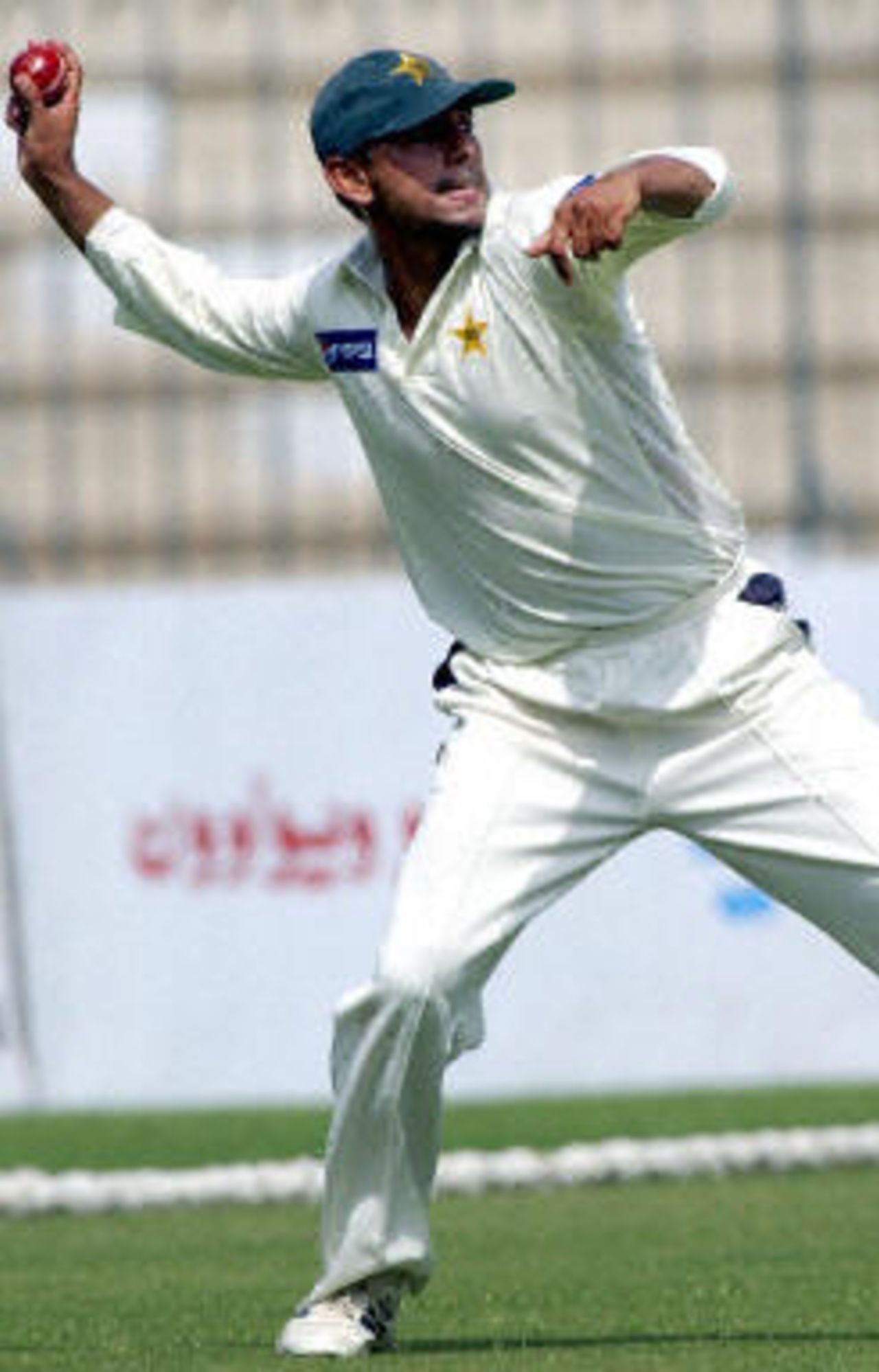 Saqlain Mushtaq throws a ball to stop a run, Pakistan v Bangladesh, 3rd Test, Multan, September 3, 2003.