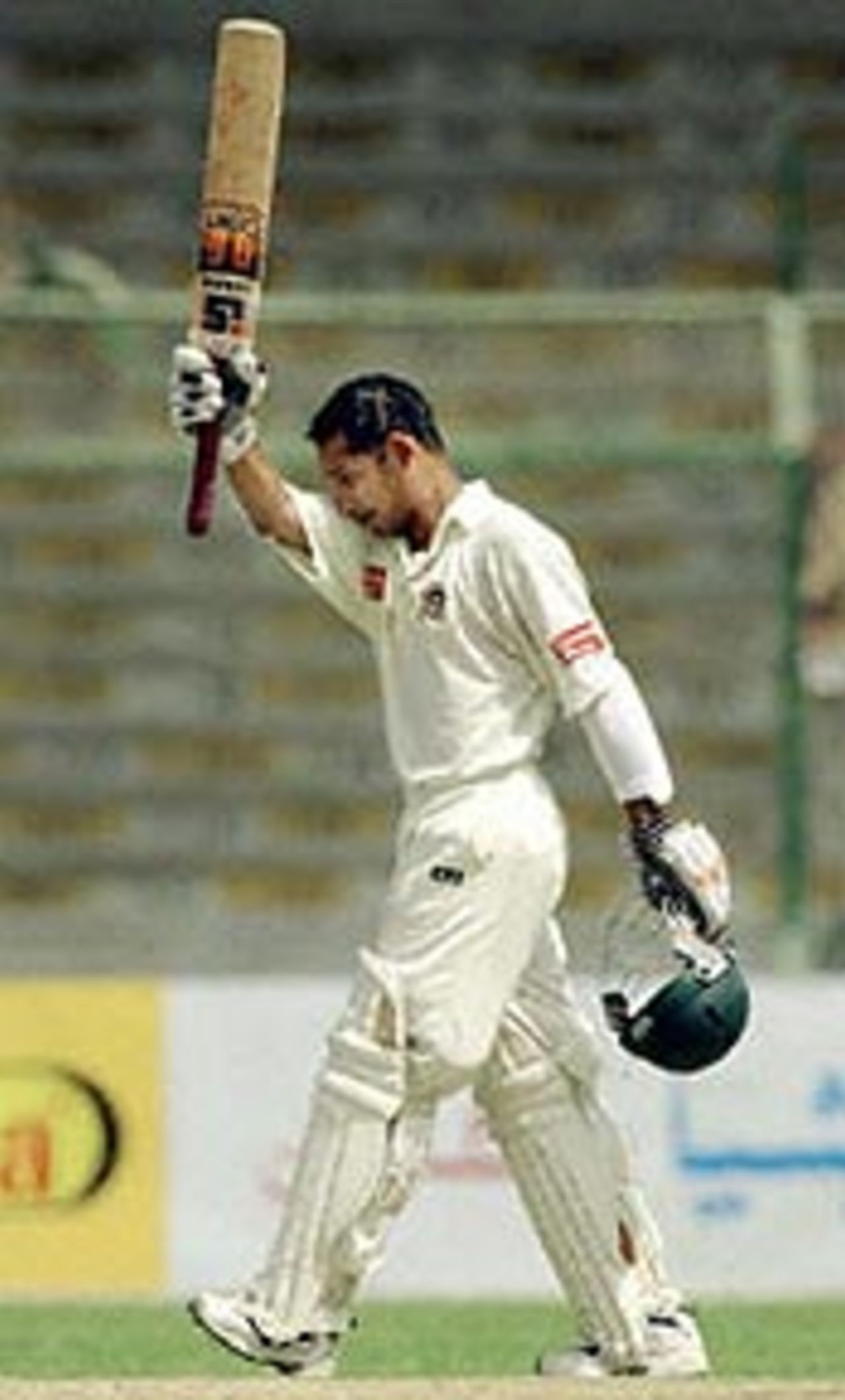 Habibul Bashar celebrates after getting a century against Pakistan in the first Test