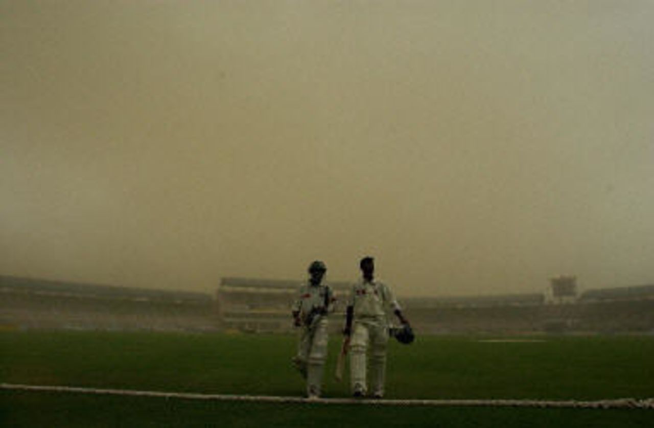 Khaled Mashud and Tapash Baisya leave the field, Pakistan v Bangladesh, 3rd Test, Multan, September 5, 2003.