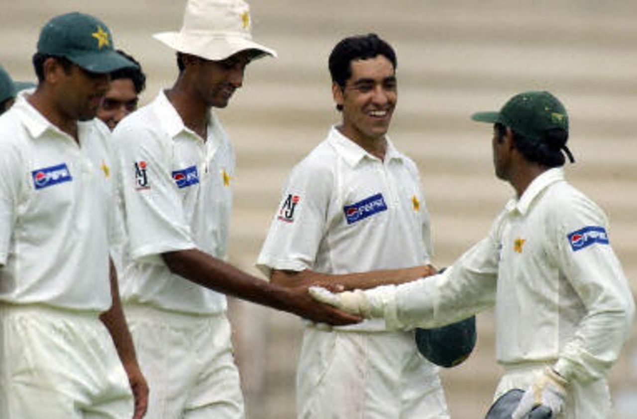 Rashid Latif congratulating Shabbir Ahmed and Umar Gul as Inzamam-ul-Haq looks on, Pakistan v Bangladesh, 3rd Test, Multan, September 5, 2003.