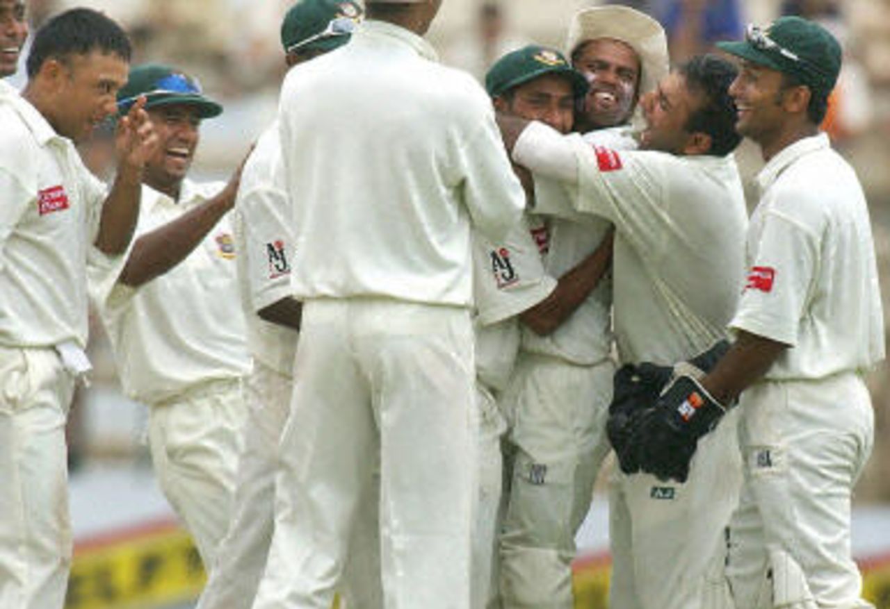 Khaled Mahmud smiles watching his players enjoying a wicket, Pakistan v Bangladesh, 3rd Test, Multan, September 5, 2003.