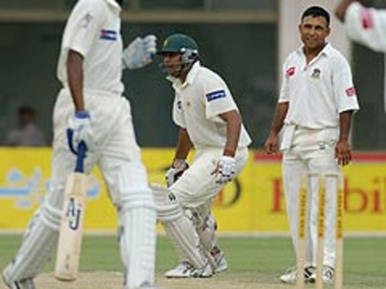 Khaled mahmud looks on as Pakistan scramble the winning runs, Pakistan v Bangladesh, 3rd Test, September 6, 2003