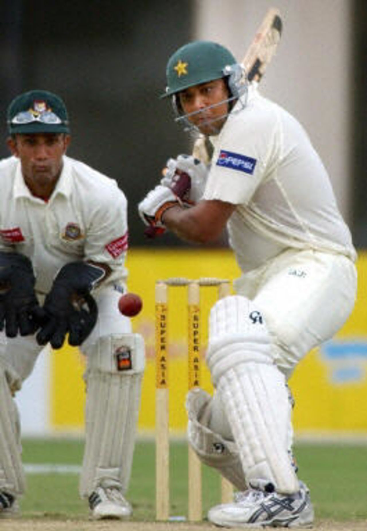 Inzamam-ul-Haq hits another four as he battled on to 138* for an unlikely win for Pakistan as Khaled Mashud looks on, Pakistan v Bangladesh, 3rd Test, Multan, September 6, 2003.