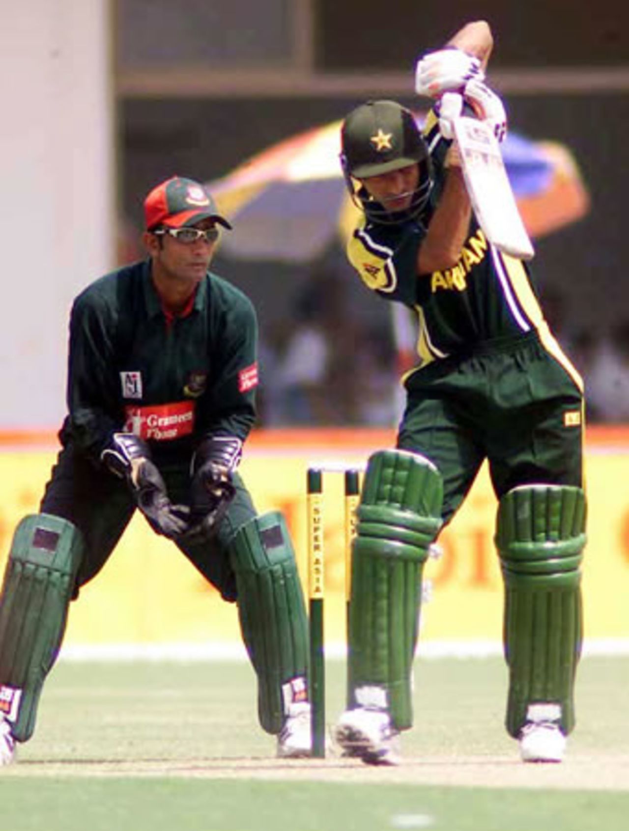 Yasir Hameed defends as Khaled Mashud looks on, Pakistan v Bangladesh, 1st ODI, Multan, September 9, 2003.