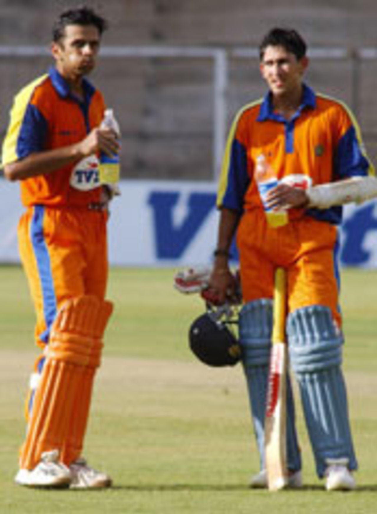 Rahul Dravid and Ajit Agarkar take a breather during their 136-run partnership, India B v India Seniors, Bangalore, September 11, 2003