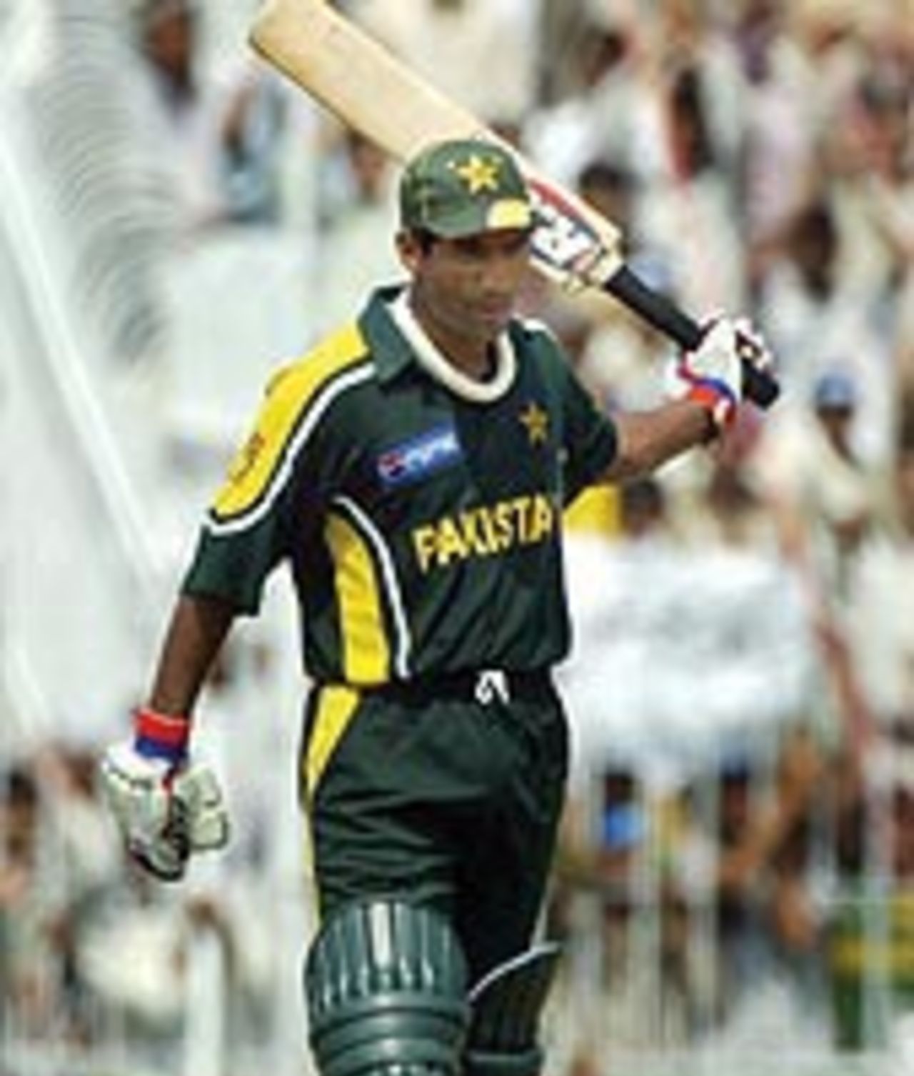 Yousuf Youhana raises his bat in acknowledgement after scoring a hundred, Pakistan v Bangladesh, 2nd ODI, Faisalabad, September 12, 2003