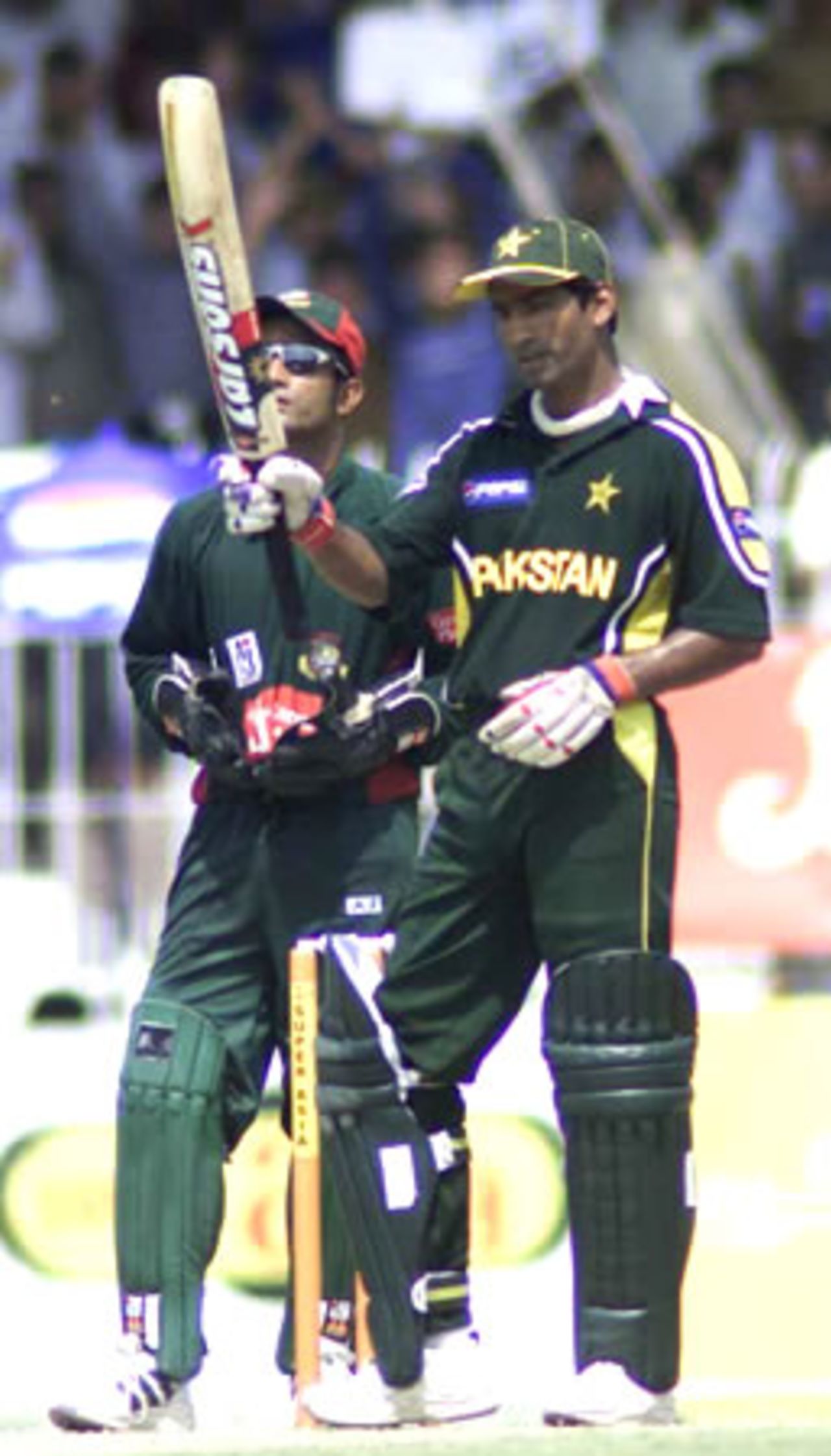 Yousuf Youhana celebrates his 9th ODI century, Pakistan v Bangladesh, 2nd ODI, Faisalabad, September 12, 2003.