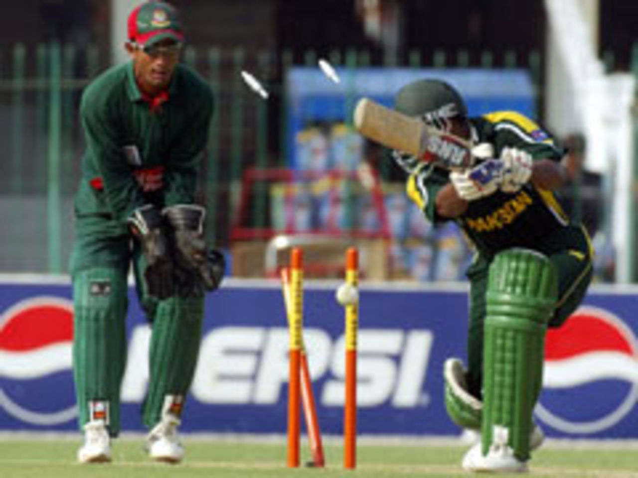 Yousuf Youhana is bowled for 65 as wicketkeeper Khaled Mashud looks on, Pak v Bang, 3rd ODI, Lahore, September 15, 2003.
