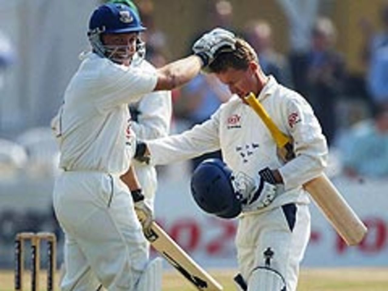 Chris Adams congratulates Murray Goodwin, as Sussex finally secure the first Championship title in their 164-year history. Both men made centuries, with Goodwin closing in on 300