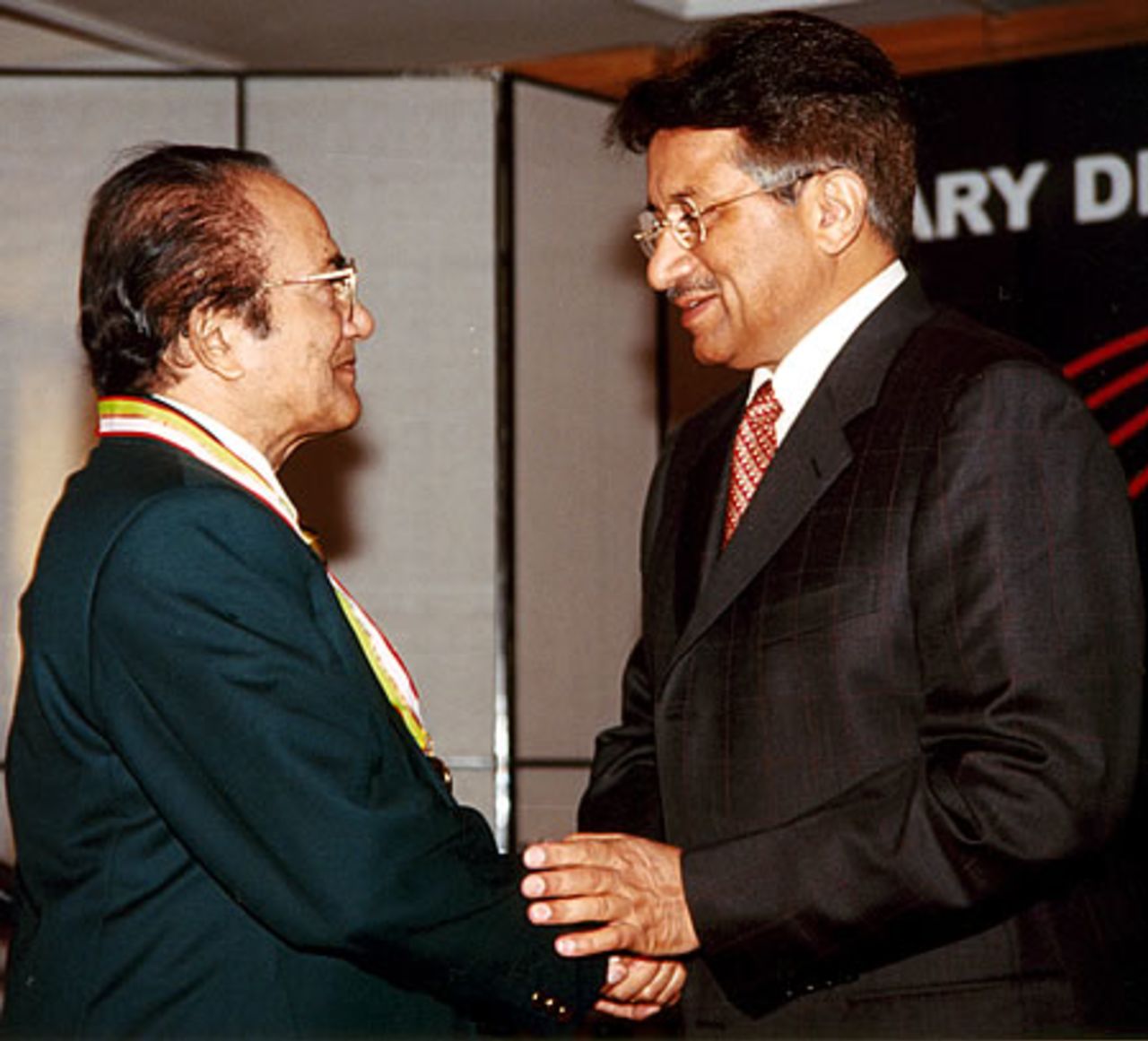 Hanif Mohammad receiving his medal from Pakistan president during the Golden Jubilee of Test Cricket Gala, Islamabad, September 16, 2003.