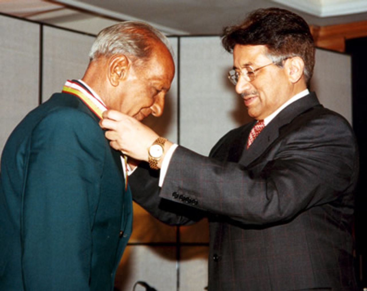 Israr Ali receiving his medal from Pakistan president during the Golden Jubilee of Test Cricket Gala, Islamabad, September 16, 2003.