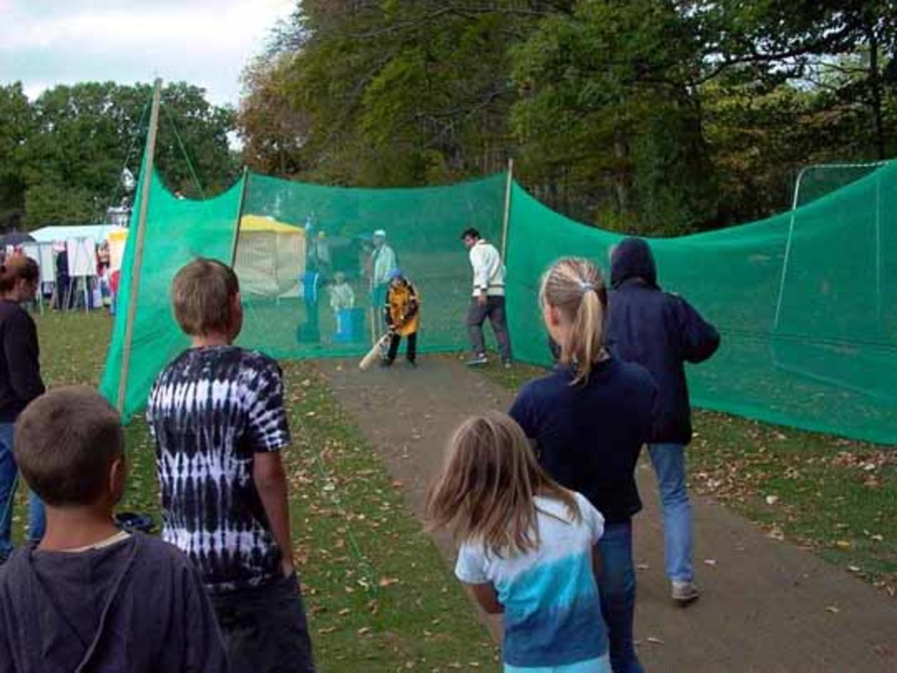 Locals try their hand at cricket in the nets at the Twenty20 competition at Hamburg's British Days