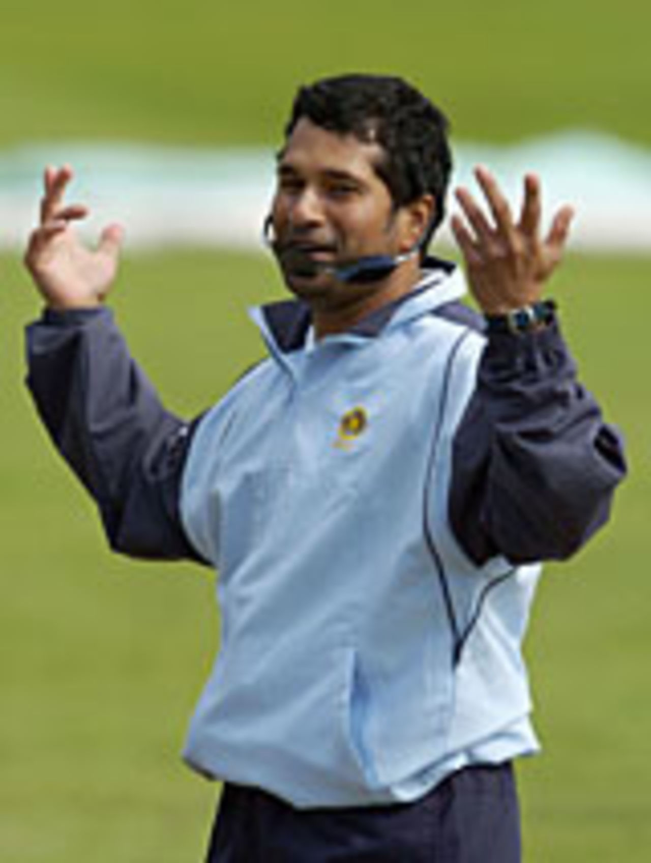 Sachin Tendulkar laughs after his sunglasses fell off while bowling, Nottingham, August 31, 2004