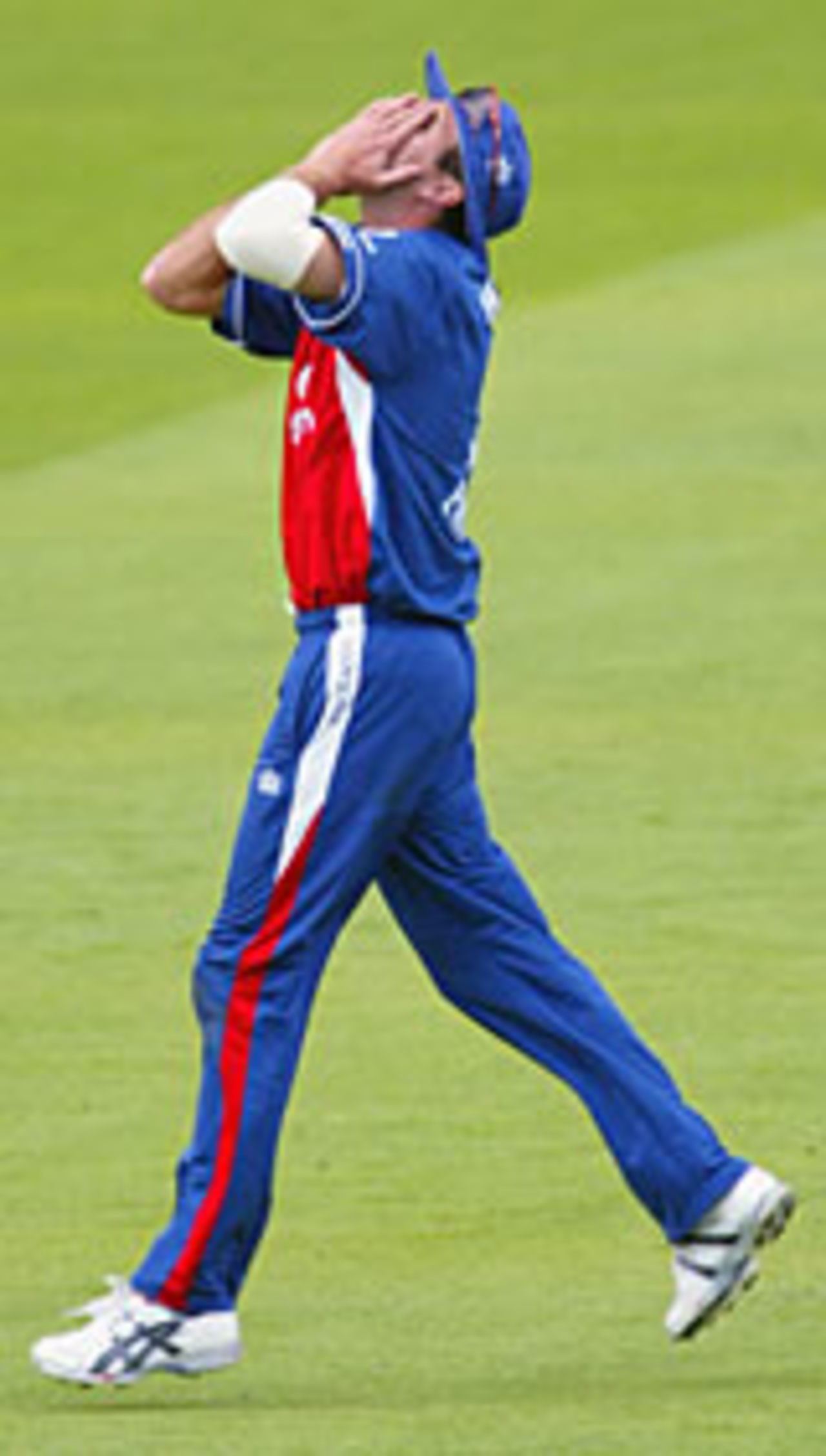 Michael Vaughan holds his head in his hands after England miss a run-out chance, July 2004