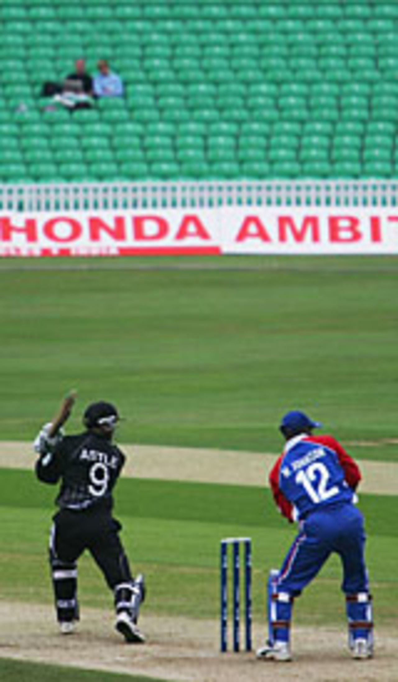 Nathan Astle drives against a backdrop of empty seats, New Zealand v USA, Champions Trophy, September 10 2004