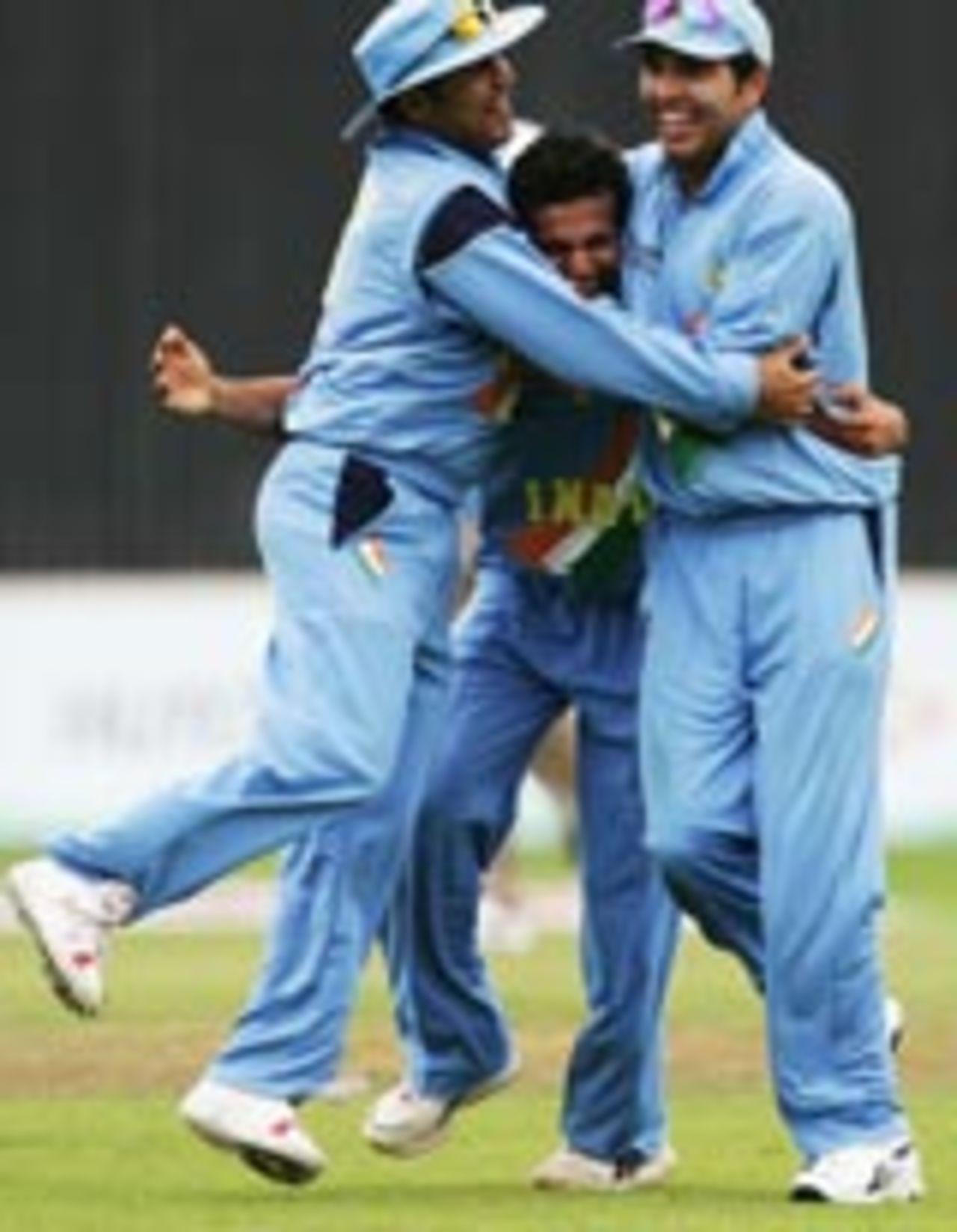 Yuvraj Singh and Virender Sehwag congratulate Pathan on an early strike, India v Pakistan, ICC Champions Trophy, September 19 2004