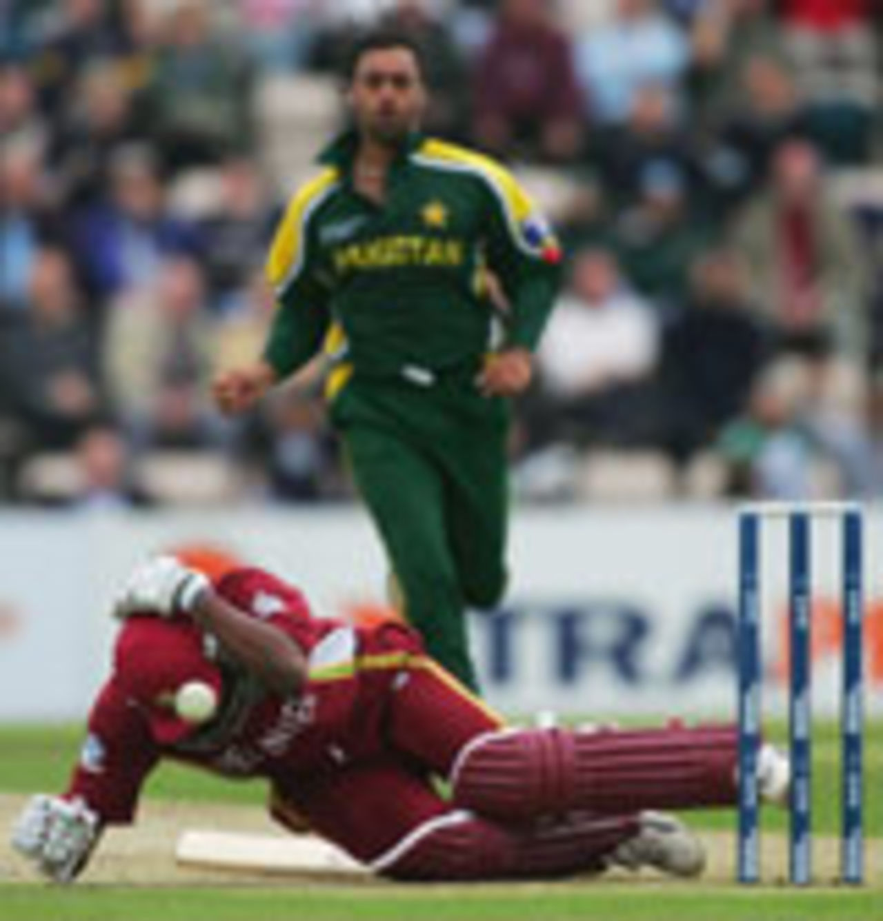 Brian Lara is felled by a sharp bouncer from Shoaib Akhtar, West Indies v Pakistan, ICC Champions Trophy, September 22 2004