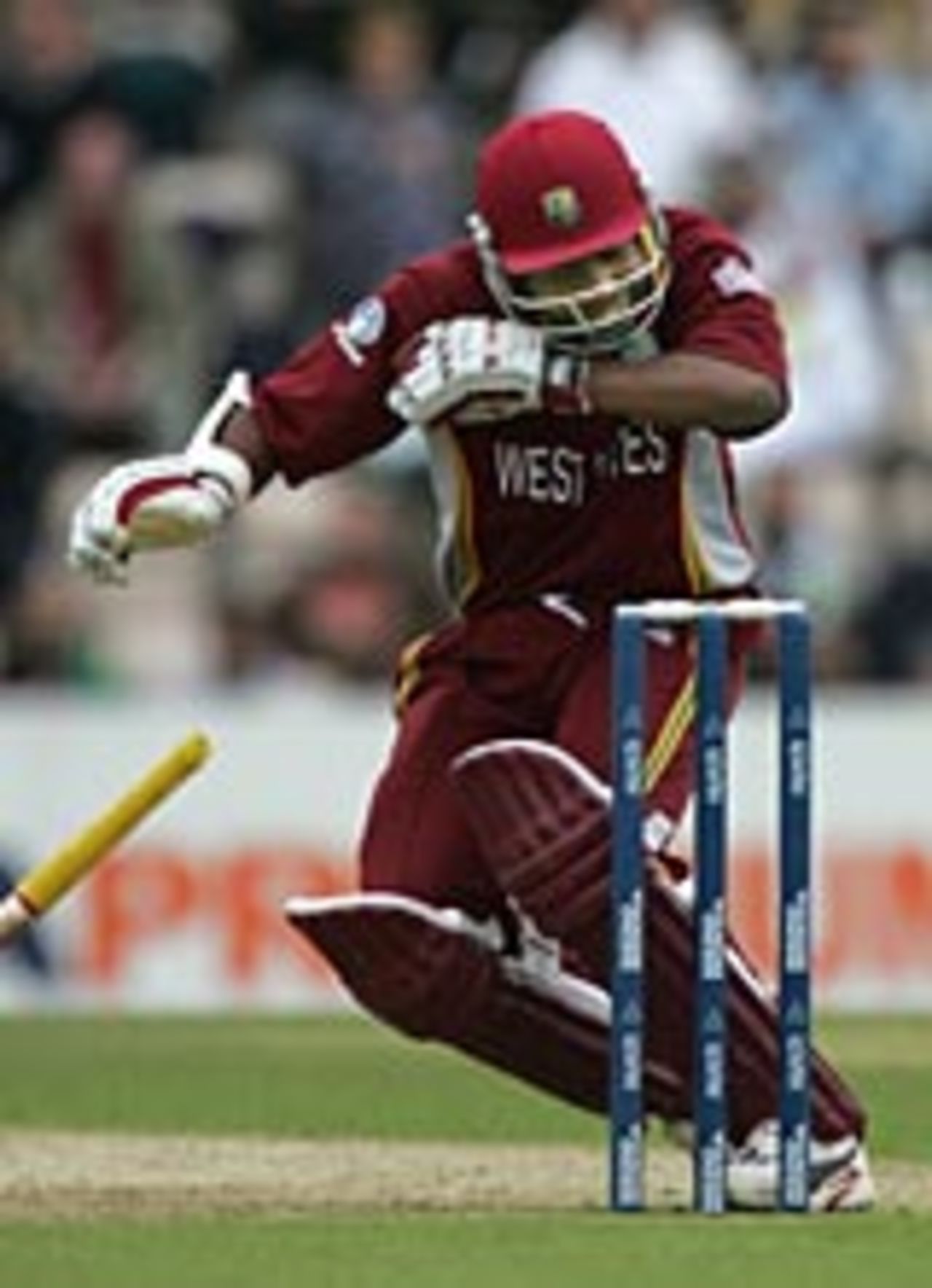 Brian Lara is felled by a sharp bouncer from Shoaib Akhtar, West Indies v Pakistan, ICC Champions Trophy, September 22 2004