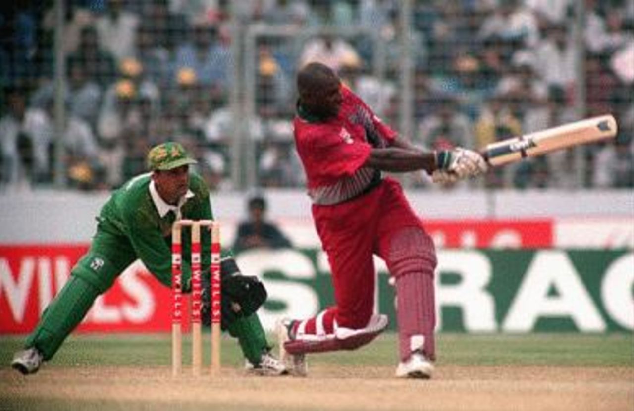 Philo Wallace hits to leg during the Pakistan - West Indies match Wills international Cup, Dhaka, Oct 29 1998 Keeper Moin looks on