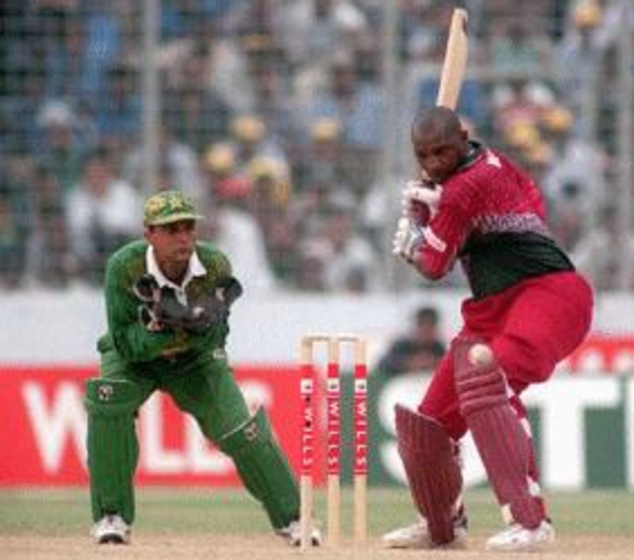 Philo Wallace looks to cut Pakistan v West Indies Wills international Cup, Dhaka, Oct 29 1998 Keeper Moin looks on