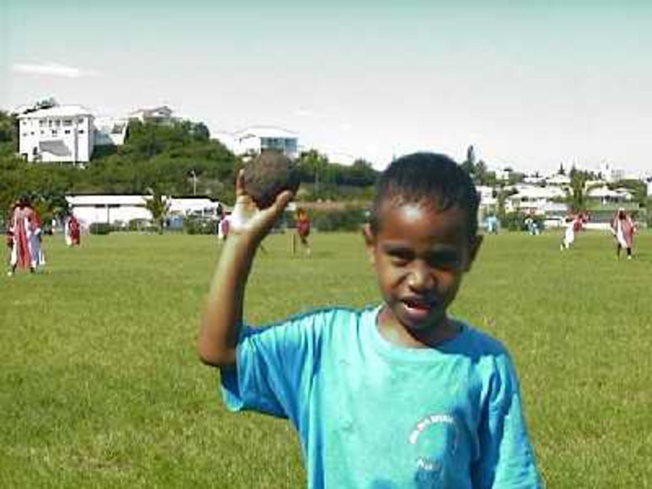 Cricket in New Caledonia style -a young lad shows off the special cricket ball