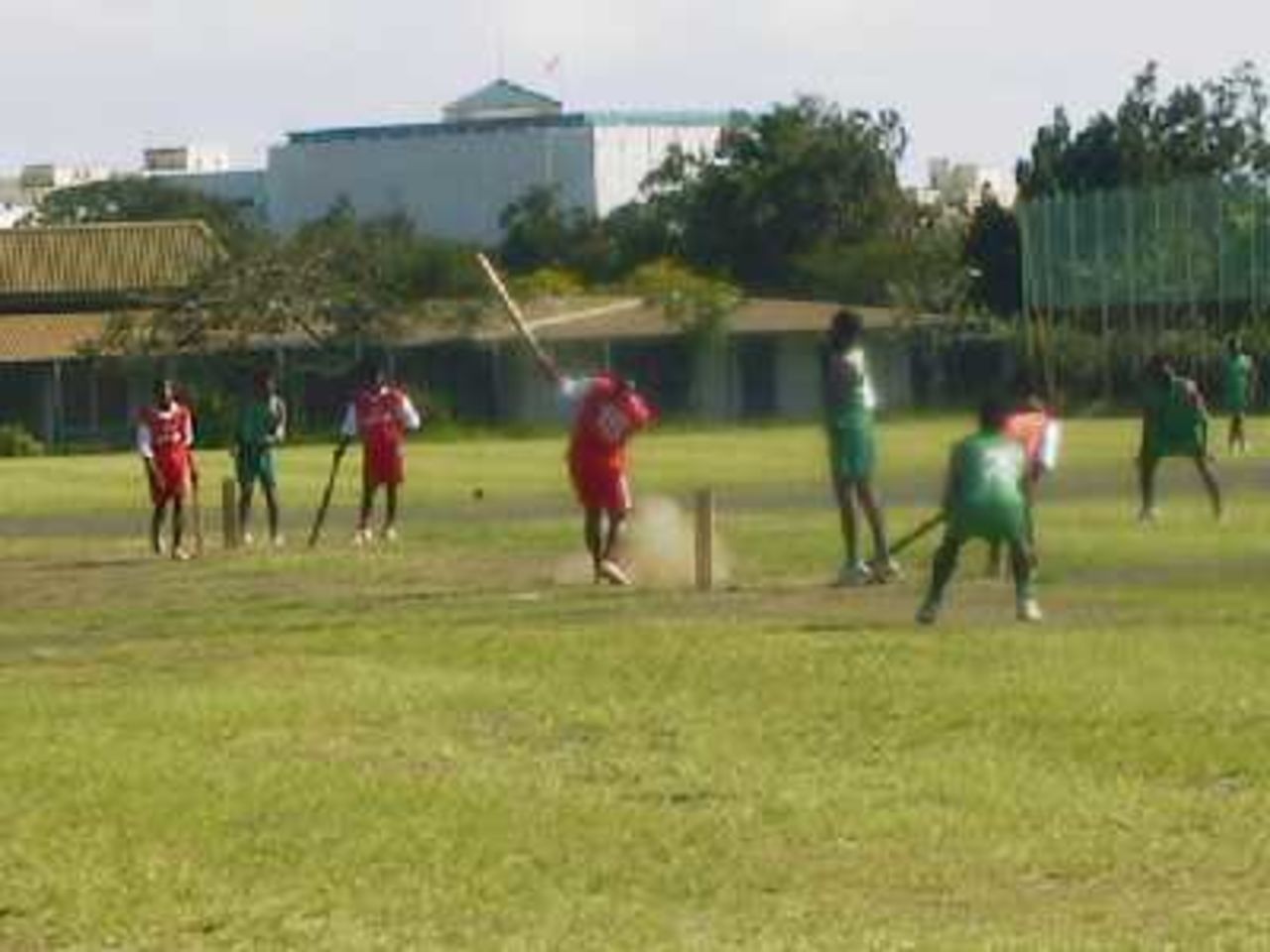 Cricket in New Caledonia style -a match in progress with a few extra batsmen, a yorker well dug out!