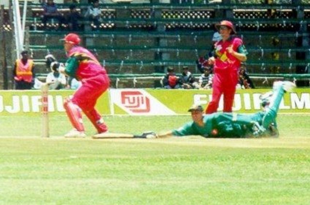 Kenya's Hitesh Modi makes sure he's not run out in Kenya's match with Zimbabwe in the 1999 LG Cup in Nairobi, Kenya