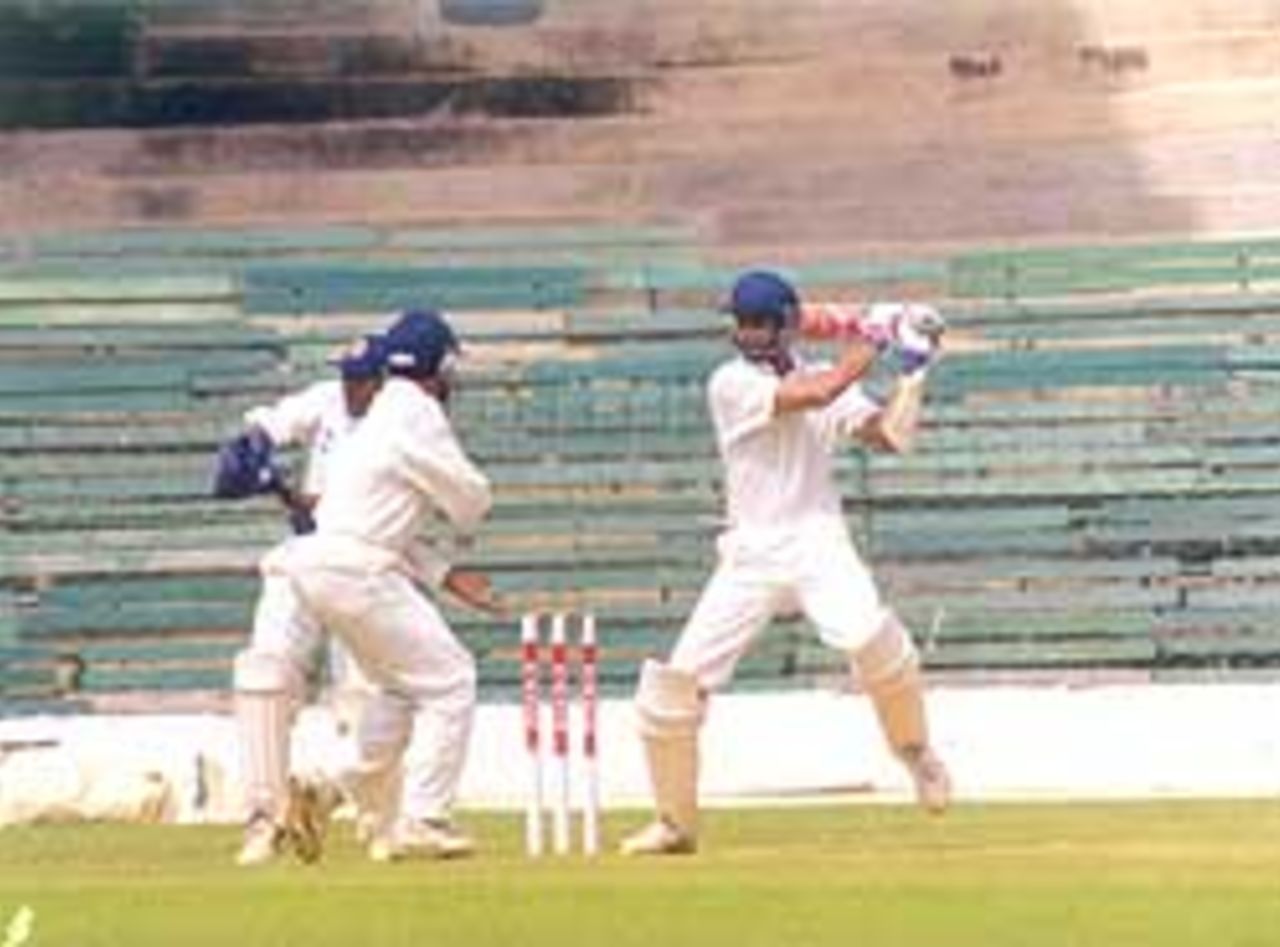 Harvinder Singh Sodhi hits out during his valuable innings of 55 in the Rest of India innings, Chinnaswamy Stadium, Irani Trophy, 1999-2000, Bangalore