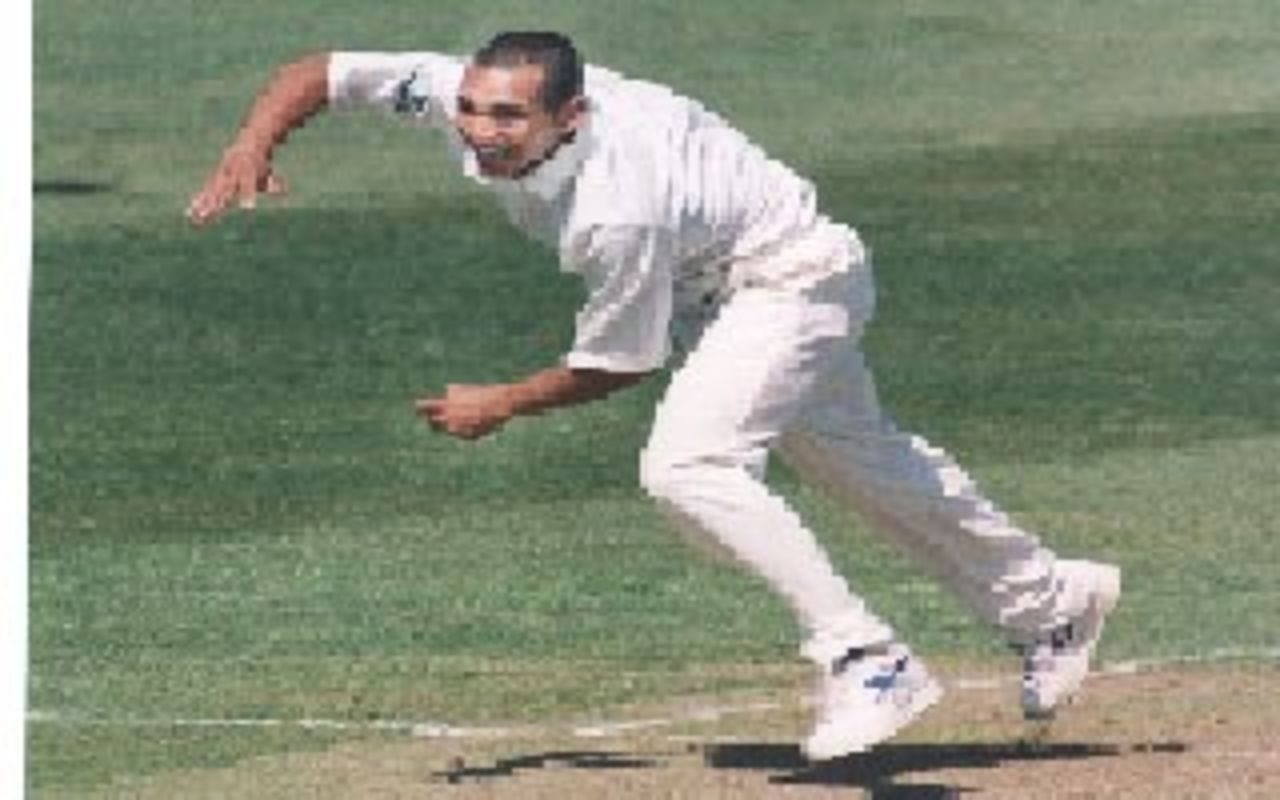 Gary Butcher bowling for Glamorgan during a Championship match in April 1997