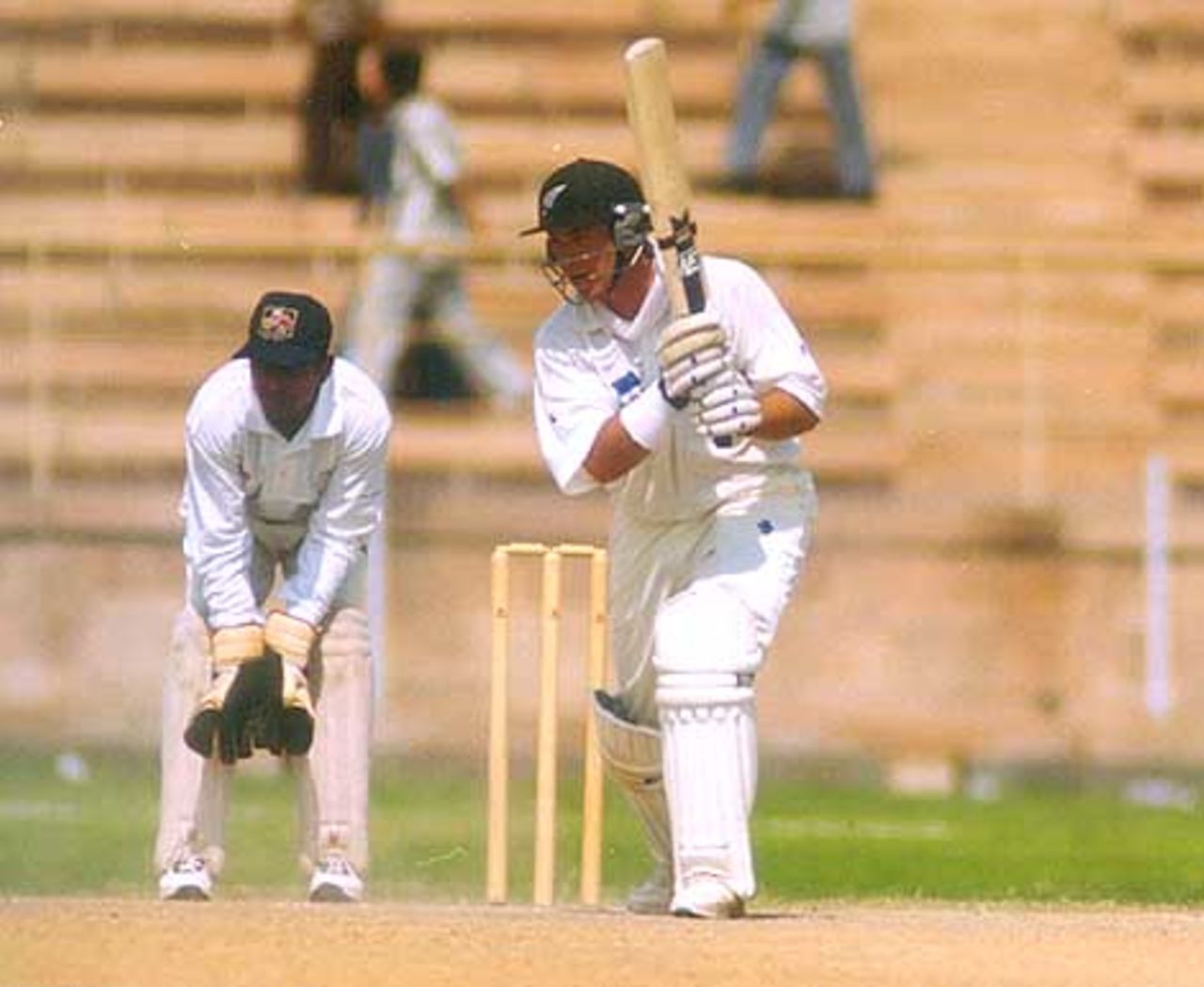 Craig McMillan drives to the cover, during day three of Indian Board President's XI v New Zealanders at Barkatullah Khan Stadium, Jodhpur, 7 October 1999, New Zealand in India, 1999/00