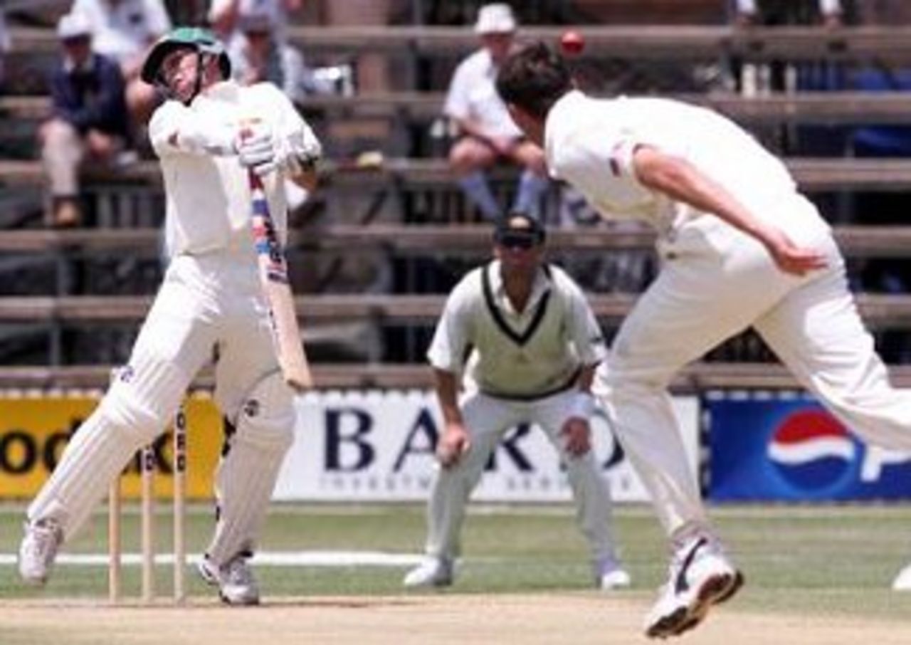 14 Oct 1999: Gavin Rennie of Zimbabwe rears up after being struck by a delivery off the bowling of Glenn McGrath of Australia during day one of the one off test match between Zimbabwe and Australia at Harare Sports Club, Harare, Zimbabwe.