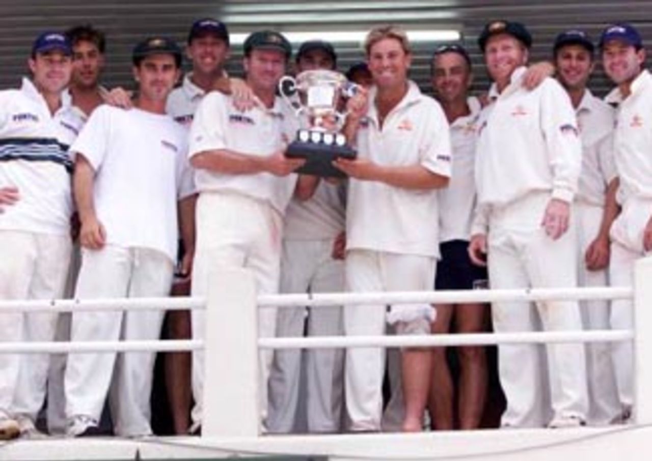 17 Oct 1999: The triumphant Australian team with the Southern Cross Trophy, after day four of the one off test match between Zimbabwe and Australia at Harare Sports Club, Harare, Zimbabwe.Australia won by 10 wickets.