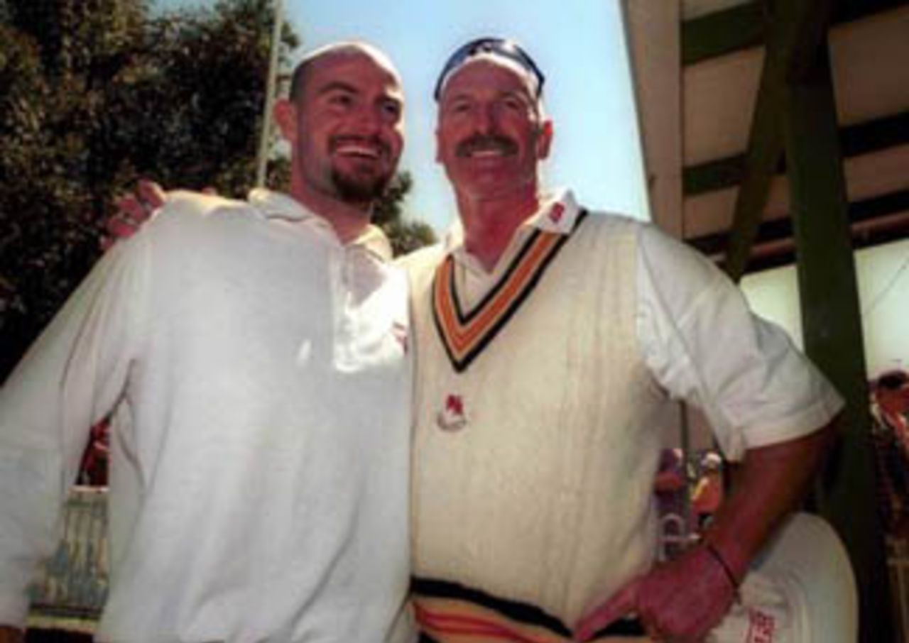 26 Oct 1999: Former Australian fast bowler Dennis Lillee (right) poses with his son Adam Lillee (left) after the two of them took six Pakistan wickets (Dennis three wickets for eight runs and Adam three wickets for twenty nine runs) during the Pakistan versus Australian Chairman's Eleven Festival cricket match played at the Lilac Hill cricket ground in Perth, Australia today.The Chairman's XI won the match by seven wickets.It was Dennis Lillee's last official cricket match at any level.